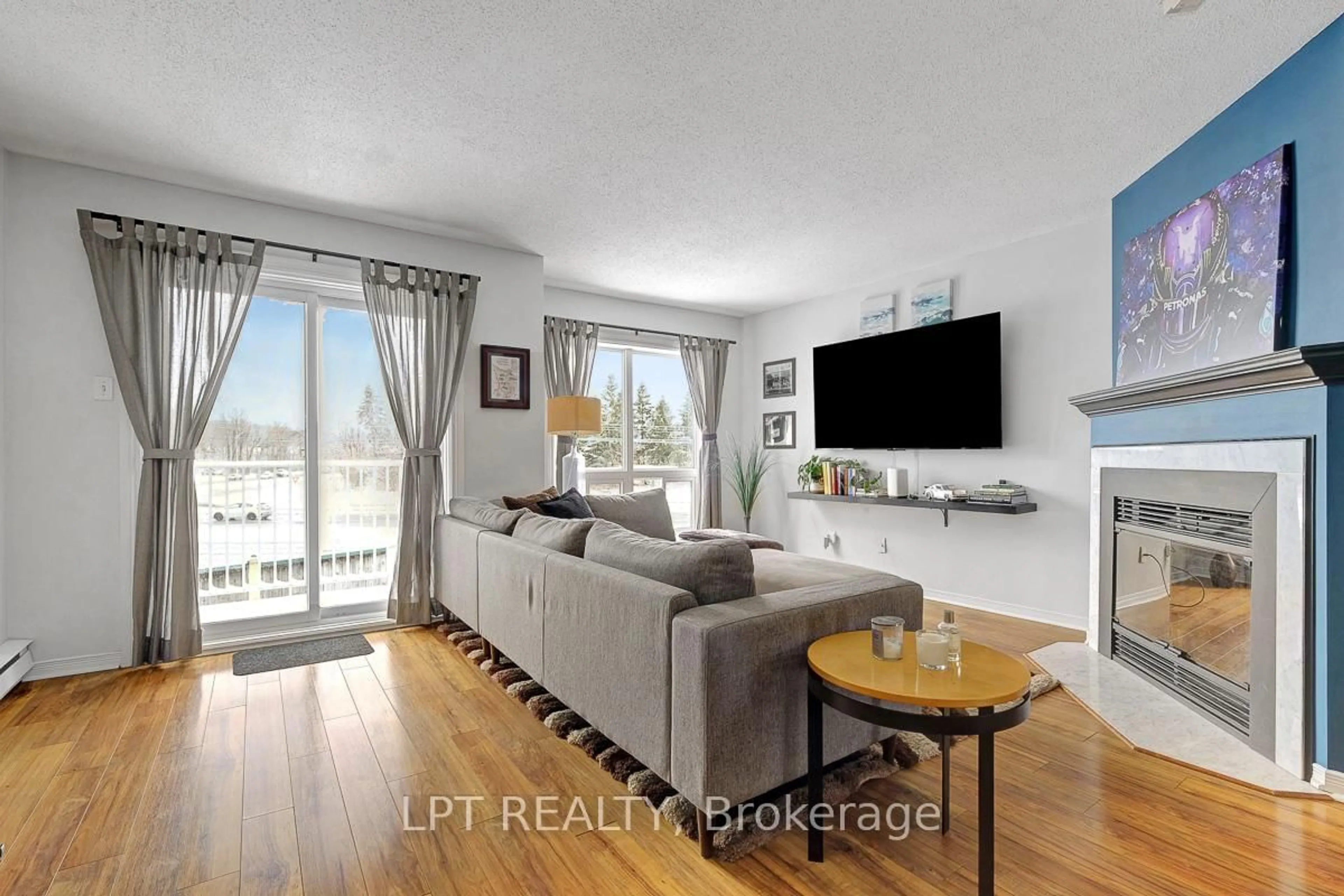 Living room with furniture, wood/laminate floor for 204 Briston Private #30, Ottawa Ontario K1G 5P8