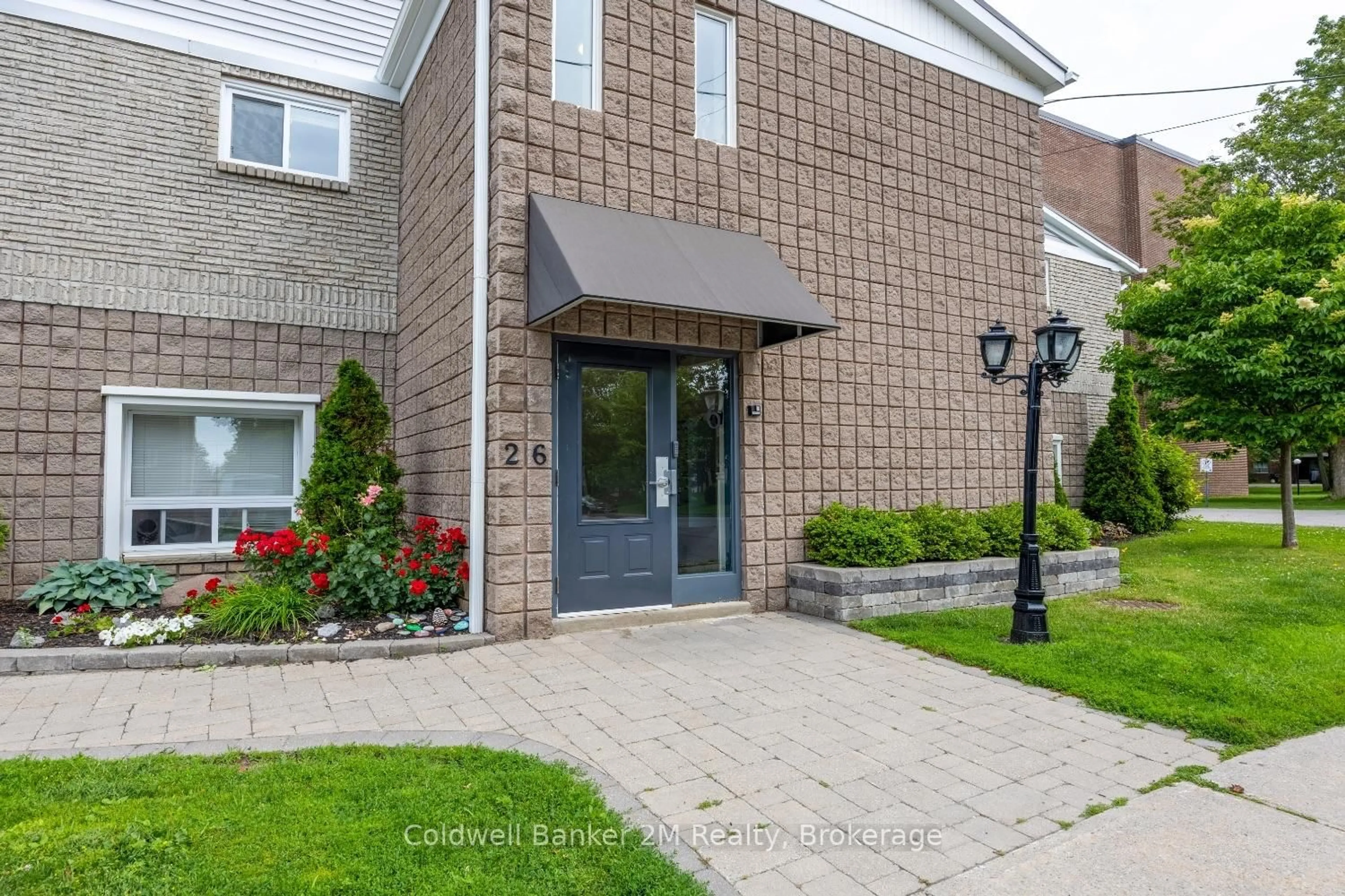 Home with brick exterior material, street for 26 Spencer St #112, Cobourg Ontario K9A 1C2