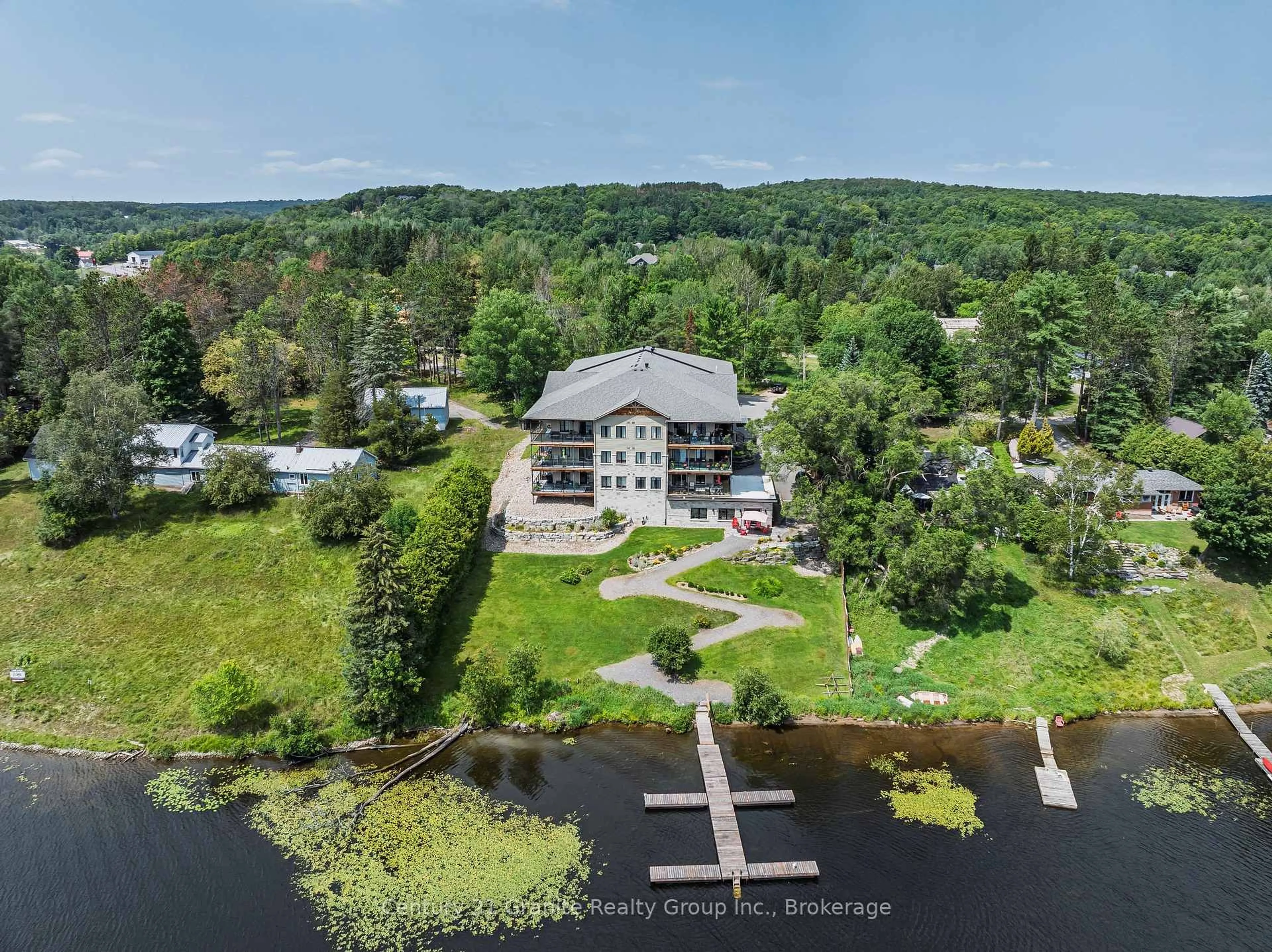 A pic from outside/outdoor area/front of a property/back of a property/a pic from drone, water/lake/river/ocean view for 75 Wallings Rd #304, Dysart et al Ontario K0M 1S0