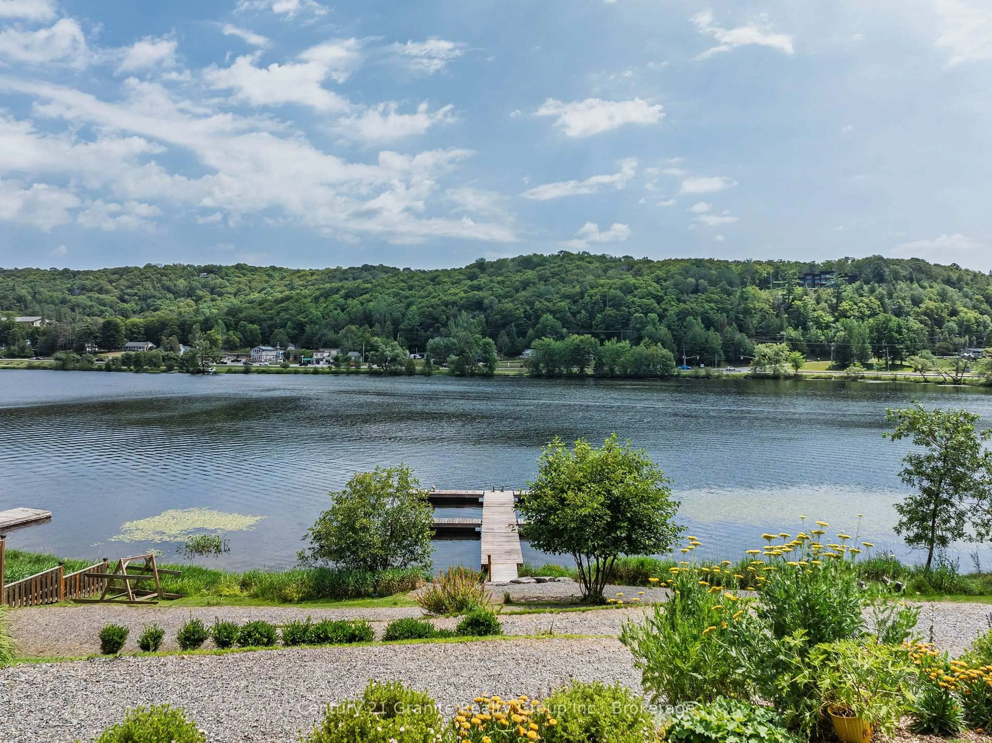 A pic from outside/outdoor area/front of a property/back of a property/a pic from drone, water/lake/river/ocean view for 75 Wallings Rd #304, Dysart et al Ontario K0M 1S0