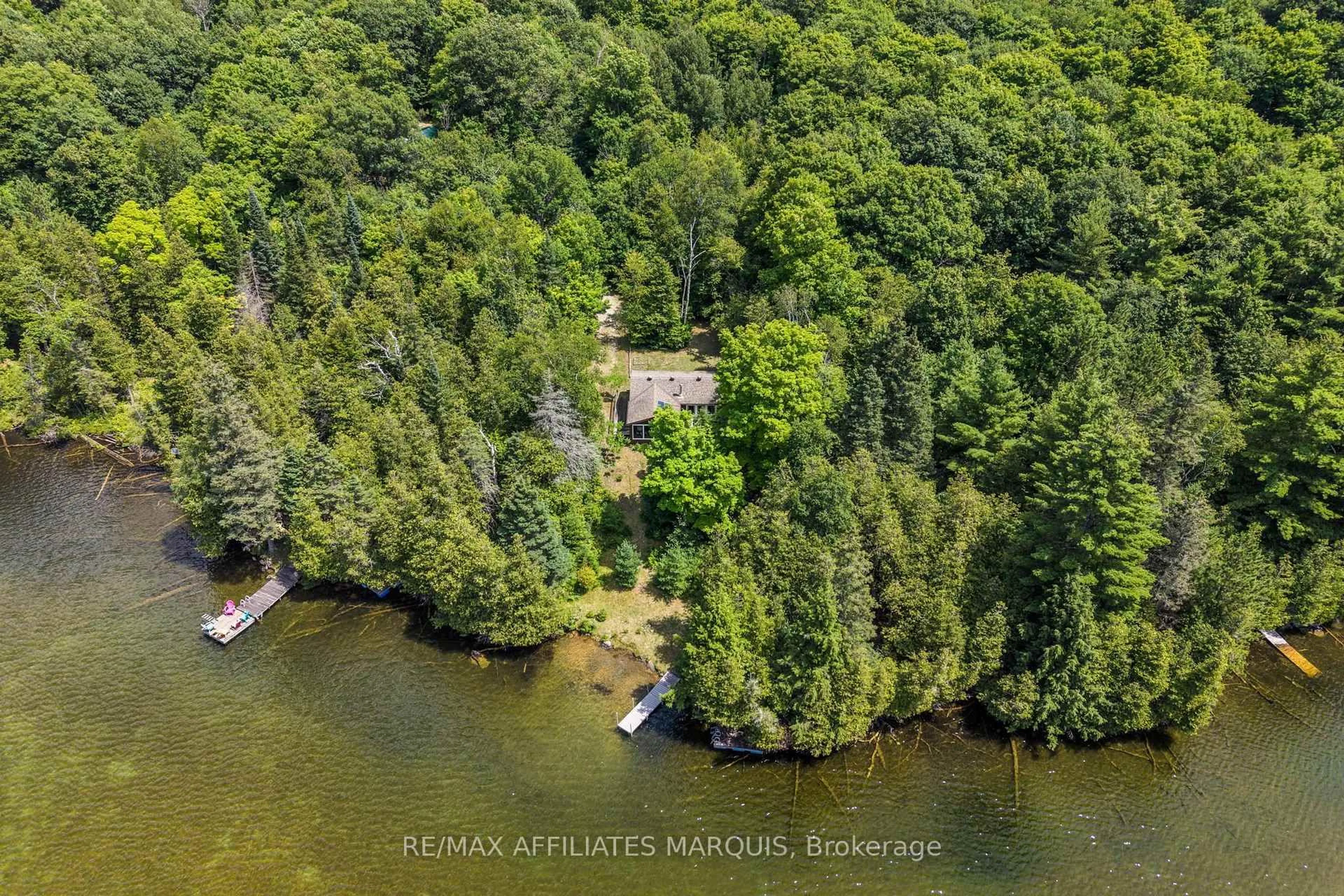 A pic from outside/outdoor area/front of a property/back of a property/a pic from drone, water/lake/river/ocean view for 1015 Penyck  Lake Lane, Sharbot Lake Ontario K0H 2P0