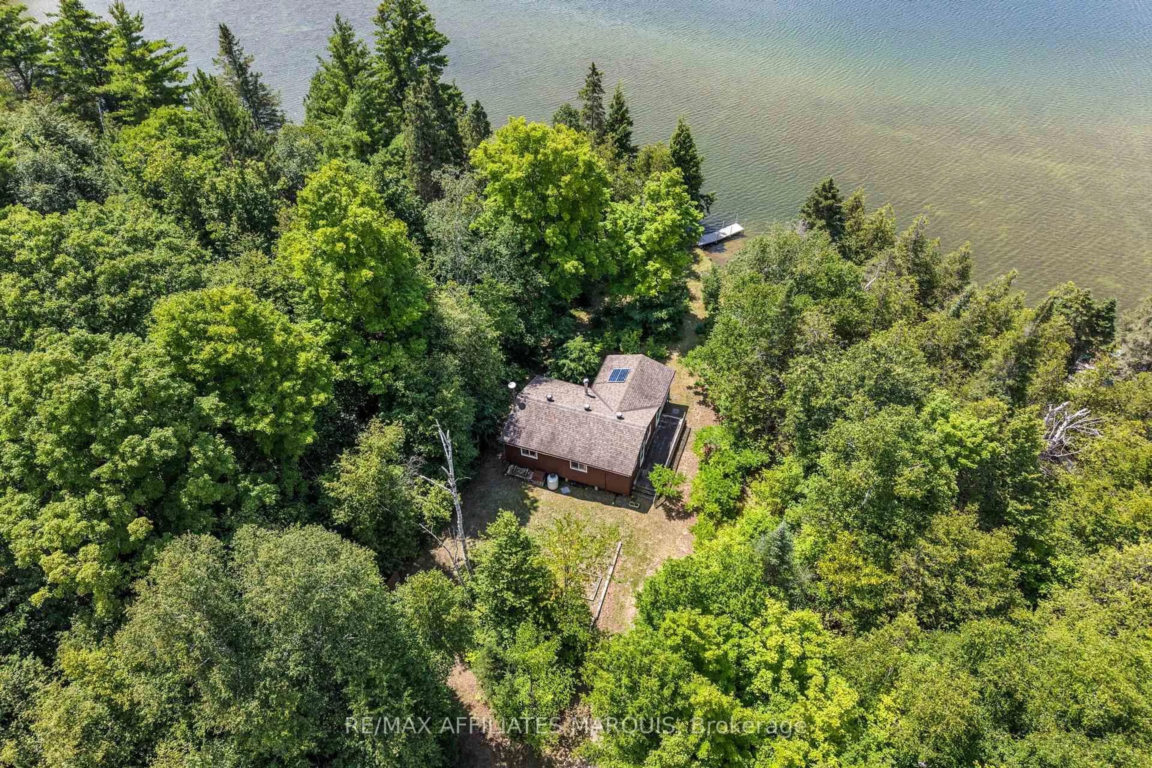 A pic from outside/outdoor area/front of a property/back of a property/a pic from drone, water/lake/river/ocean view for 1015 Penyck  Lake Lane, Sharbot Lake Ontario K0H 2P0