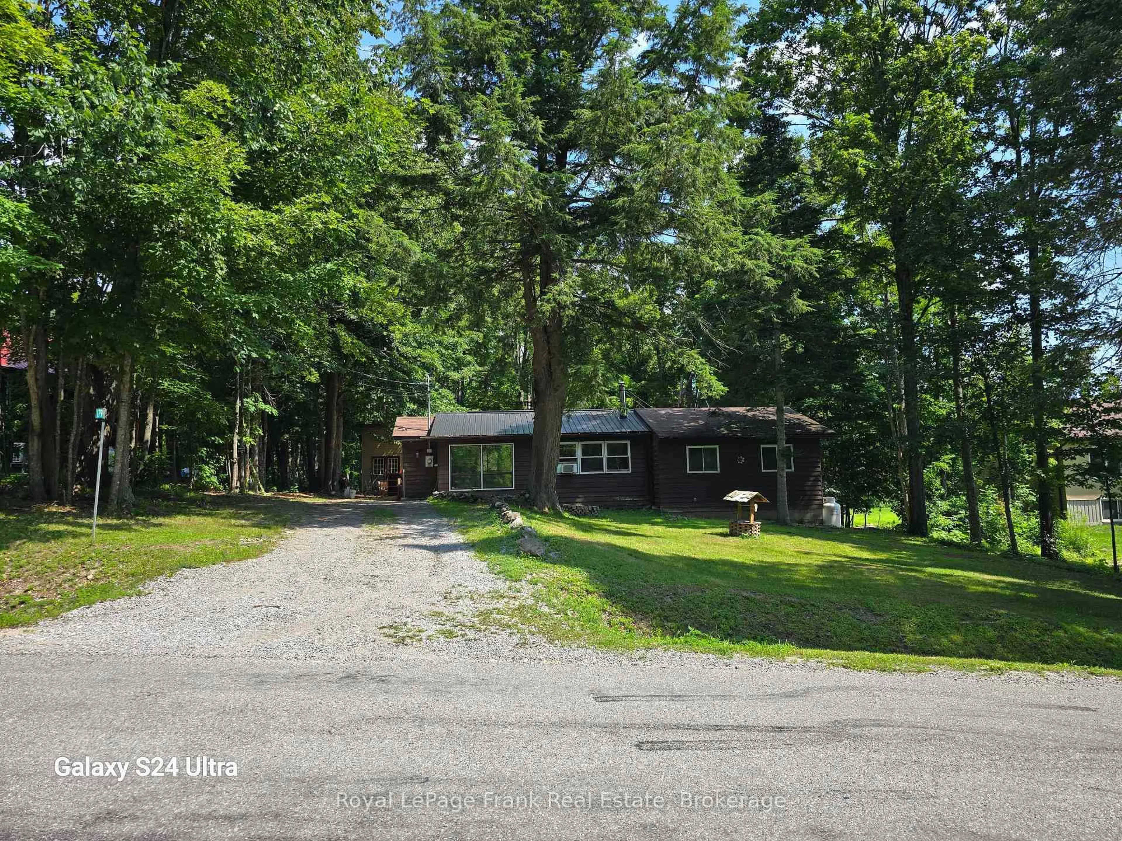 A pic from outside/outdoor area/front of a property/back of a property/a pic from drone, unknown for 179 Northern Ave, Trent Lakes Ontario K0M 1A0