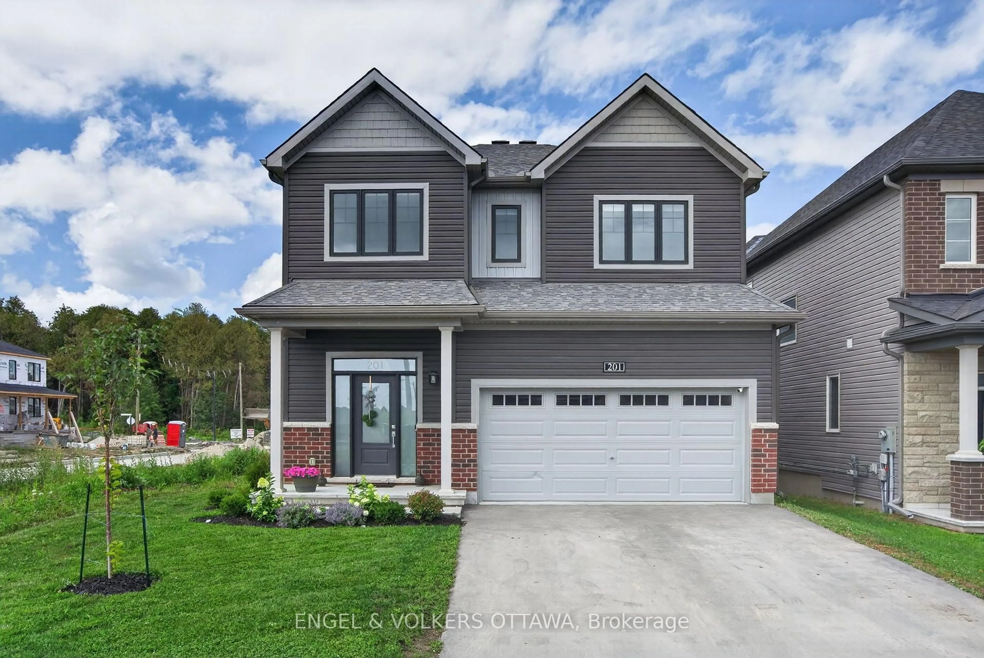 Home with brick exterior material, street for 201 Elsie MacGill Walk, Ottawa Ontario K2W 0L5