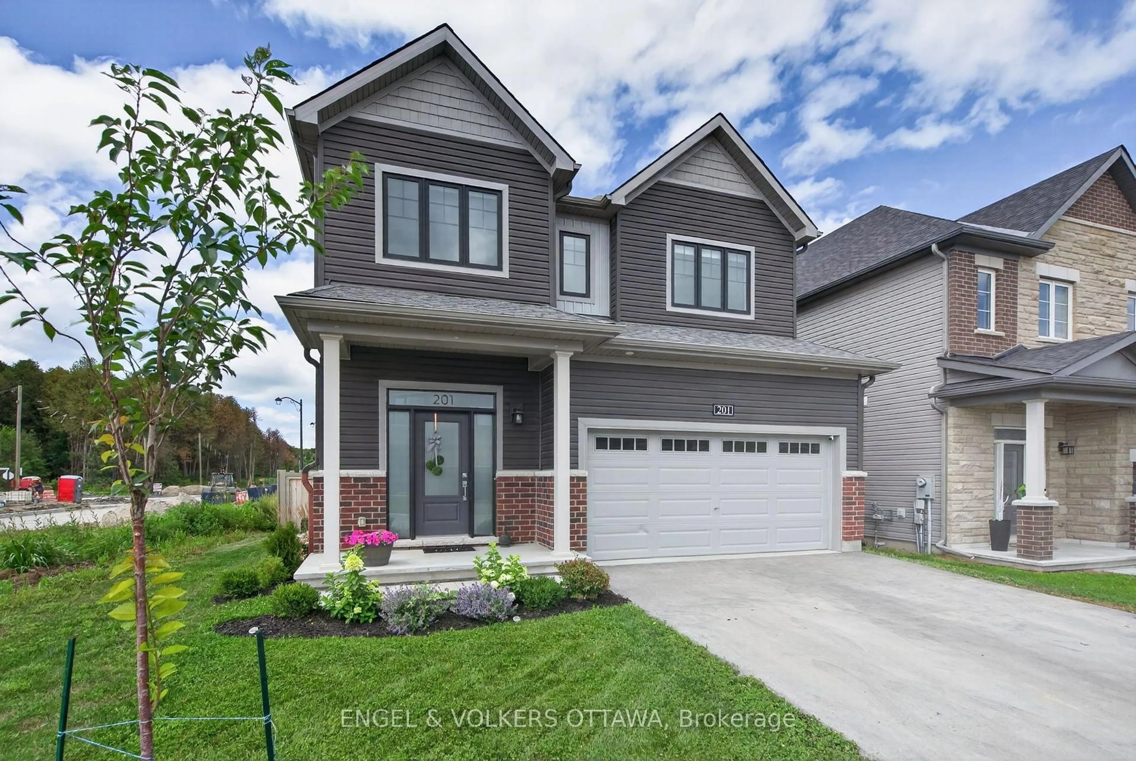 Home with brick exterior material, street for 201 Elsie MacGill Walk, Ottawa Ontario K2W 0L5