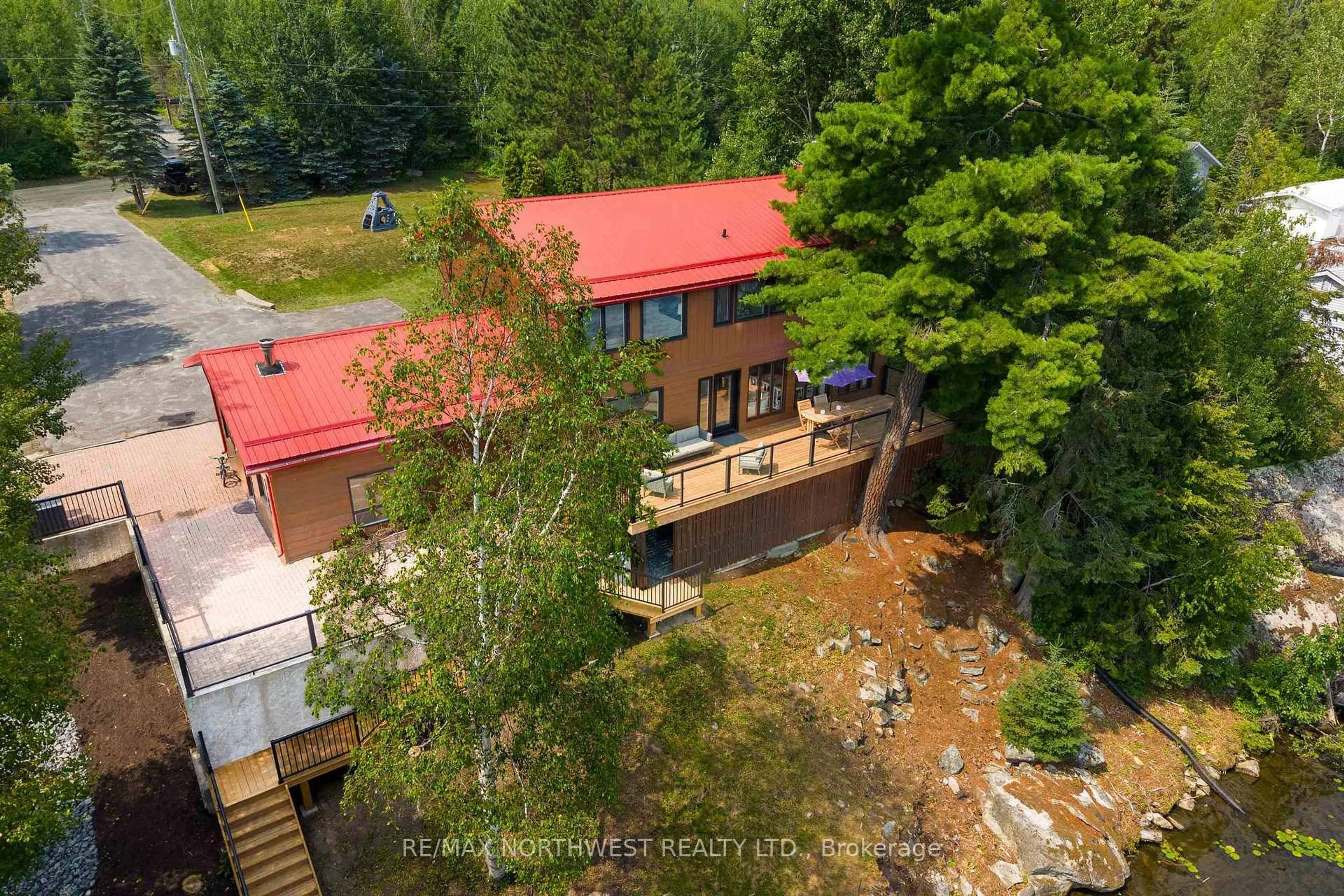 A pic from outside/outdoor area/front of a property/back of a property/a pic from drone, forest/trees view for 38 Kimberly Road, Kenora Remote Area Ontario P0X 1H0