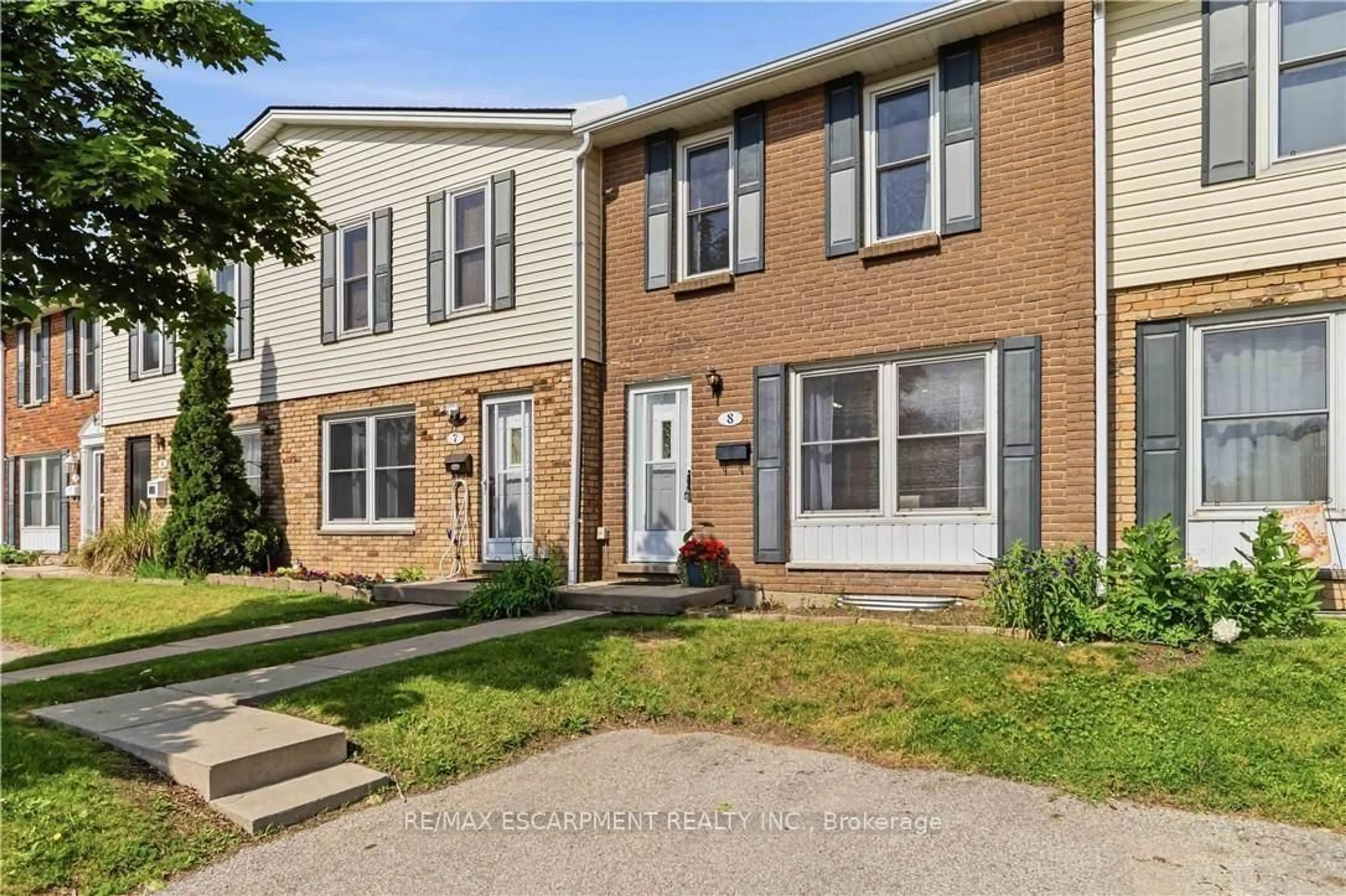 Home with brick exterior material, street for 596 Grey St #8, Brantford Ontario N3S 4Y1