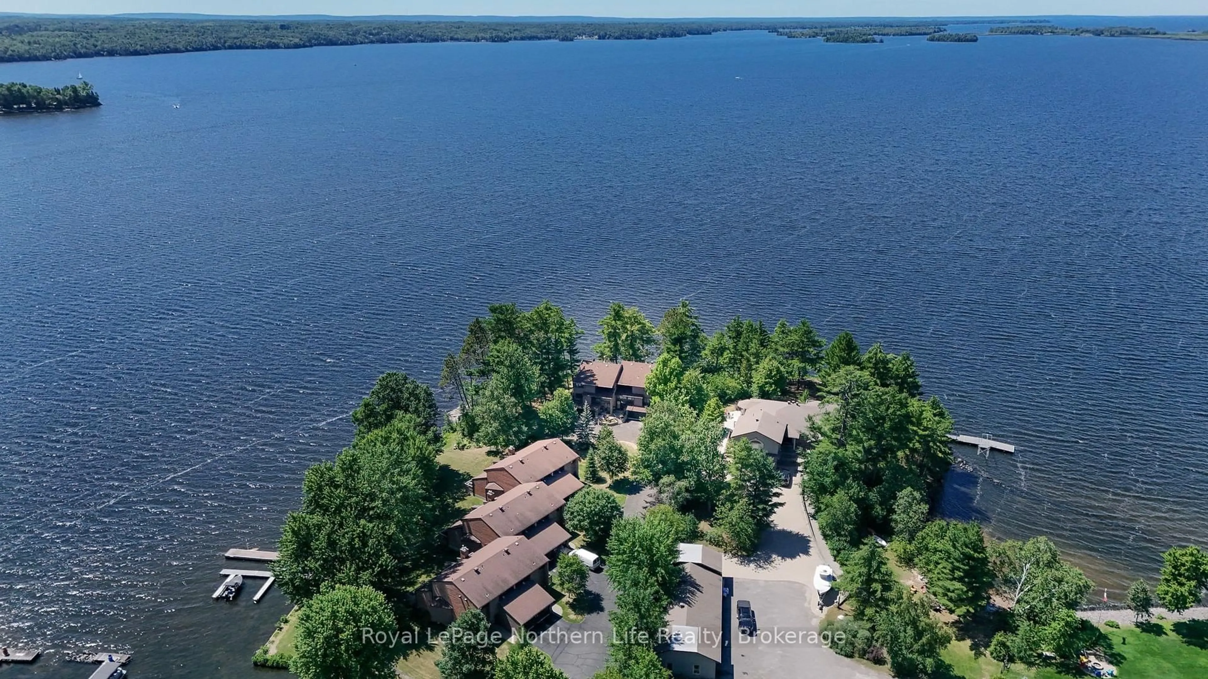 A pic from outside/outdoor area/front of a property/back of a property/a pic from drone, water/lake/river/ocean view for 555 Main St #12, Callander Ontario P0H 1H0