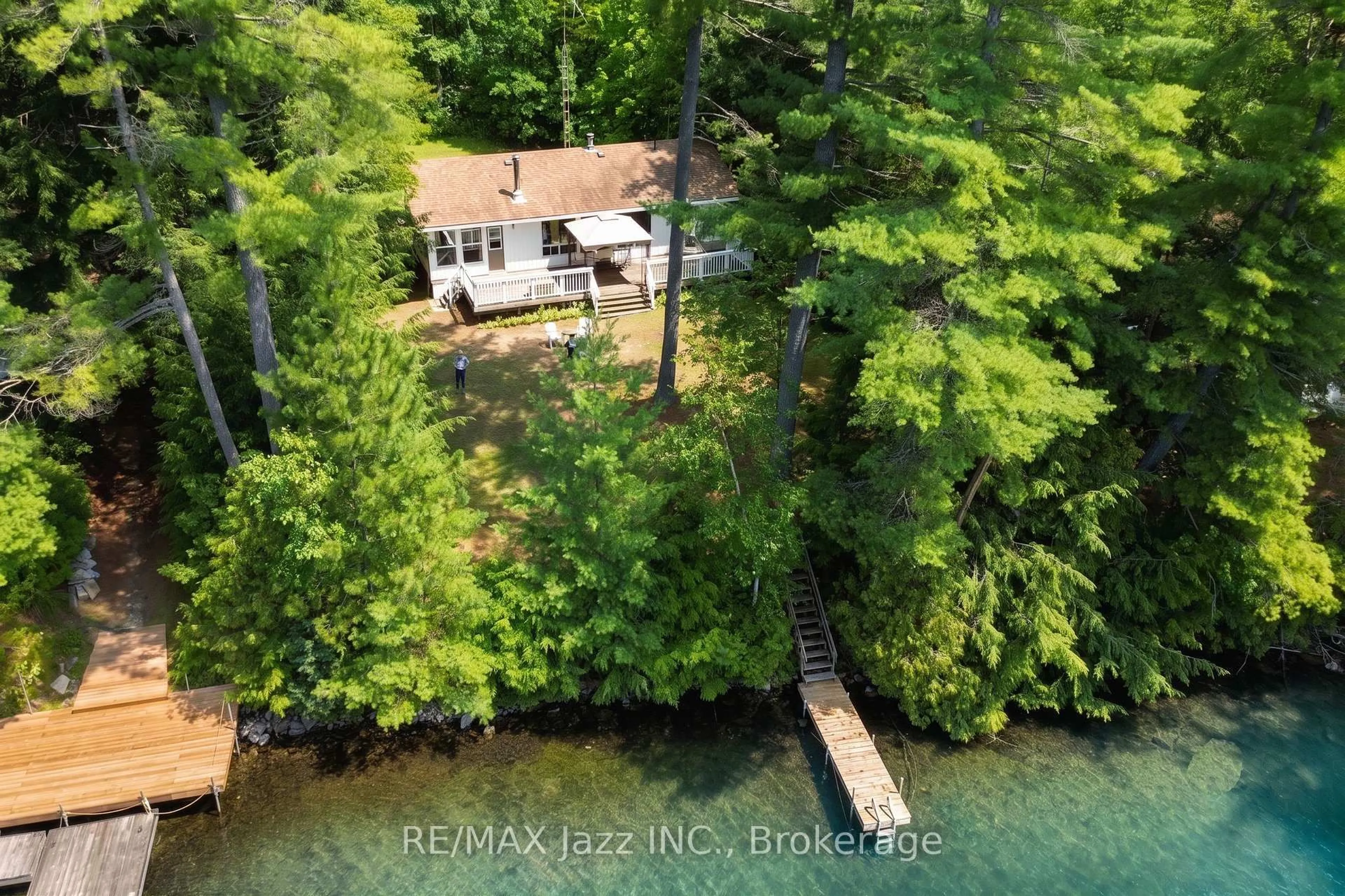A pic from outside/outdoor area/front of a property/back of a property/a pic from drone, water/lake/river/ocean view for 2006 South Beaver Lake Lane, Minden Hills Ontario K0M 2L1