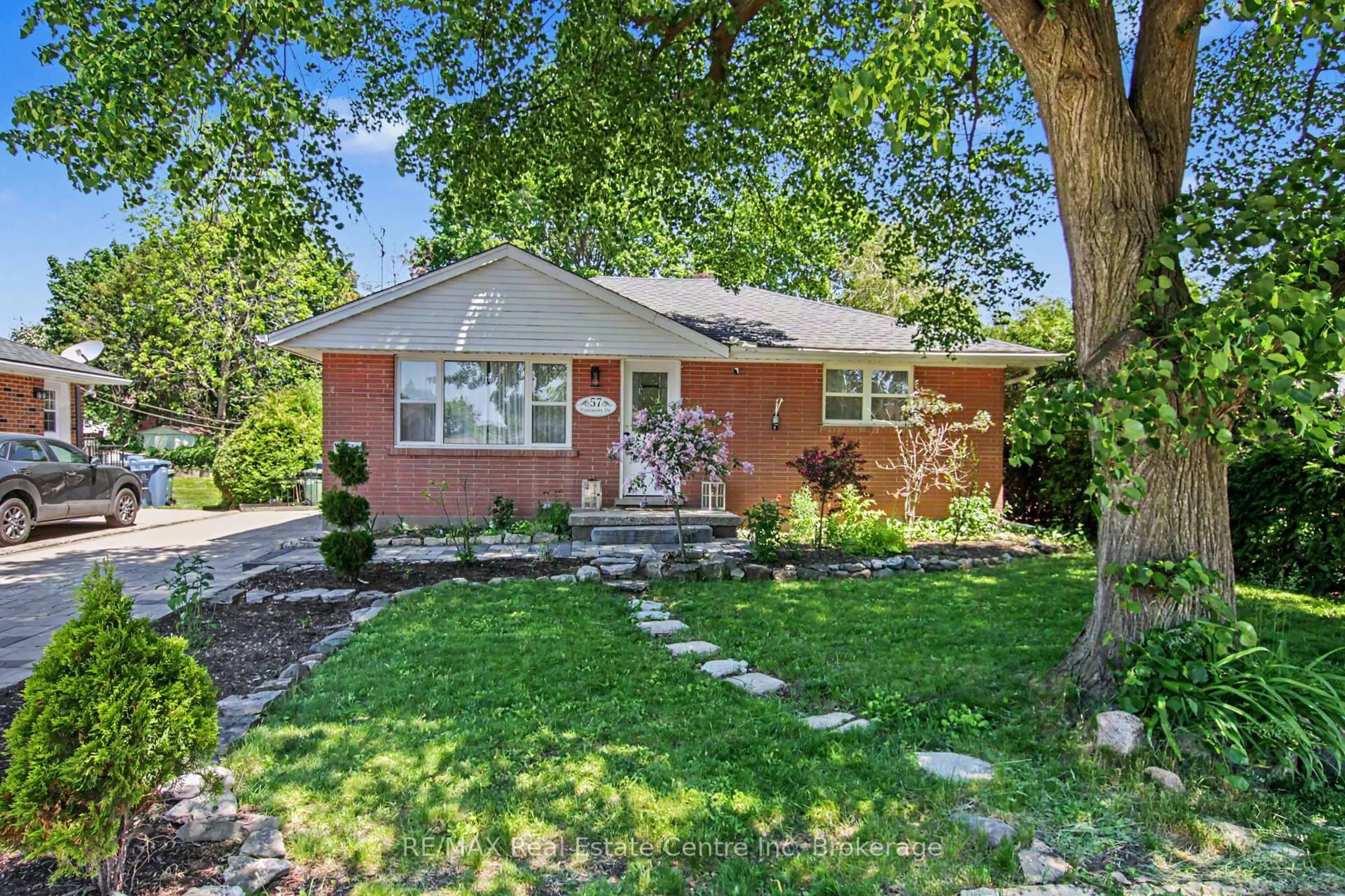 Home with brick exterior material, street for 57 Vancouver Dr, Guelph Ontario N1E 2G1