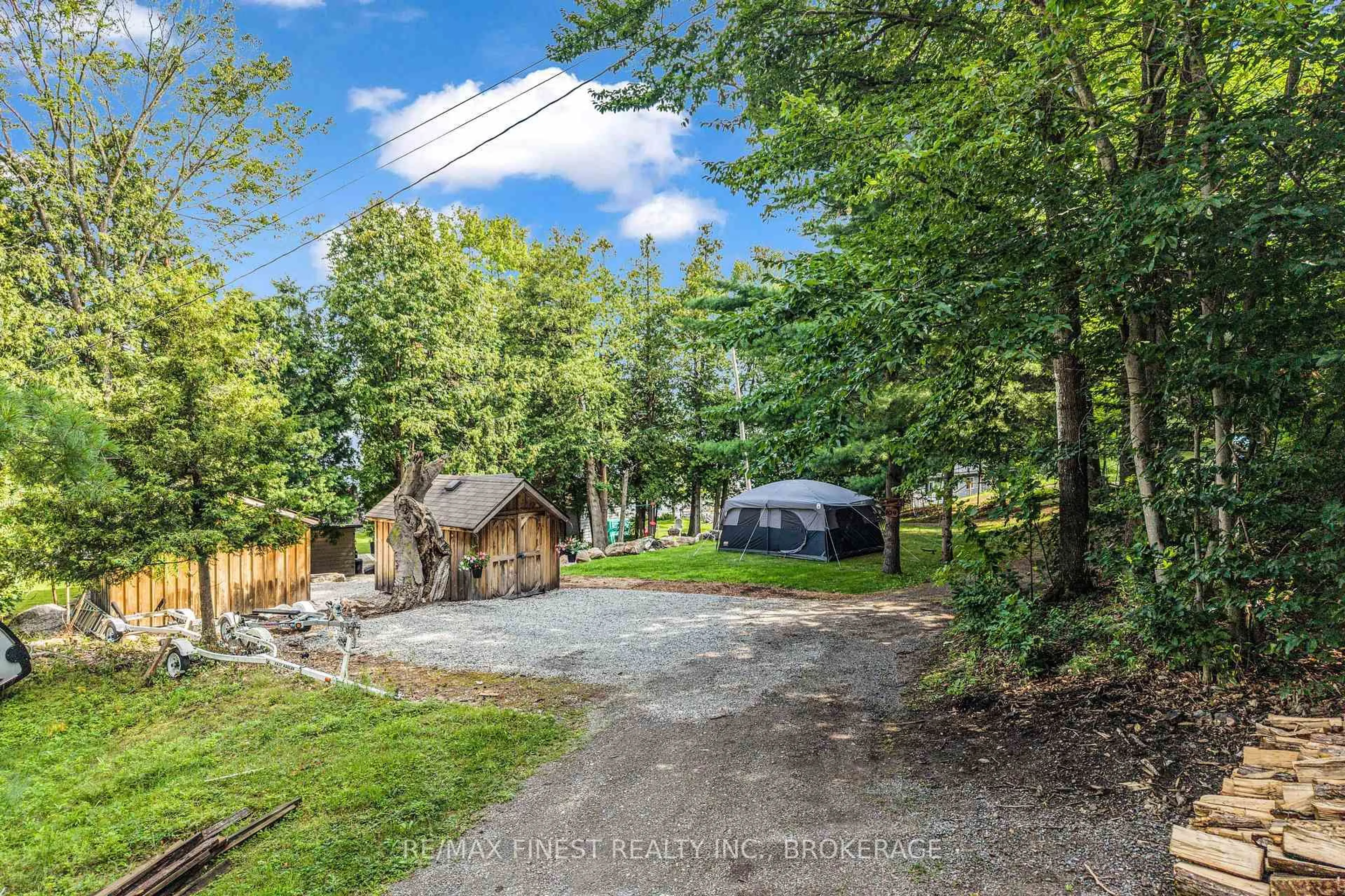 A pic from outside/outdoor area/front of a property/back of a property/a pic from drone, forest/trees view for 104 Farren Lake Lane #41, Westport Ontario K0G 1X0