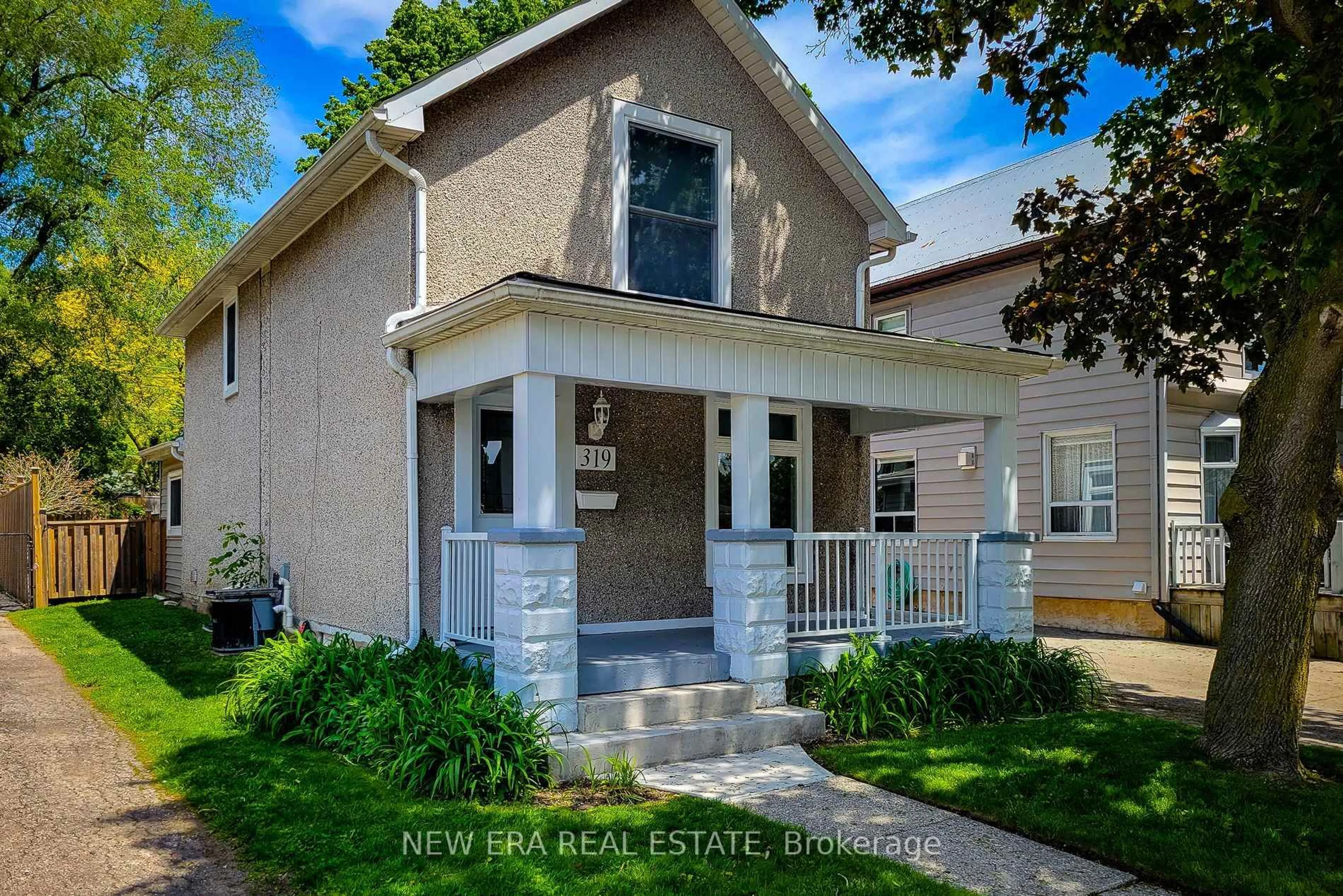 Home with brick exterior material, street for 319 King St, Hamilton Ontario L9H 1W5
