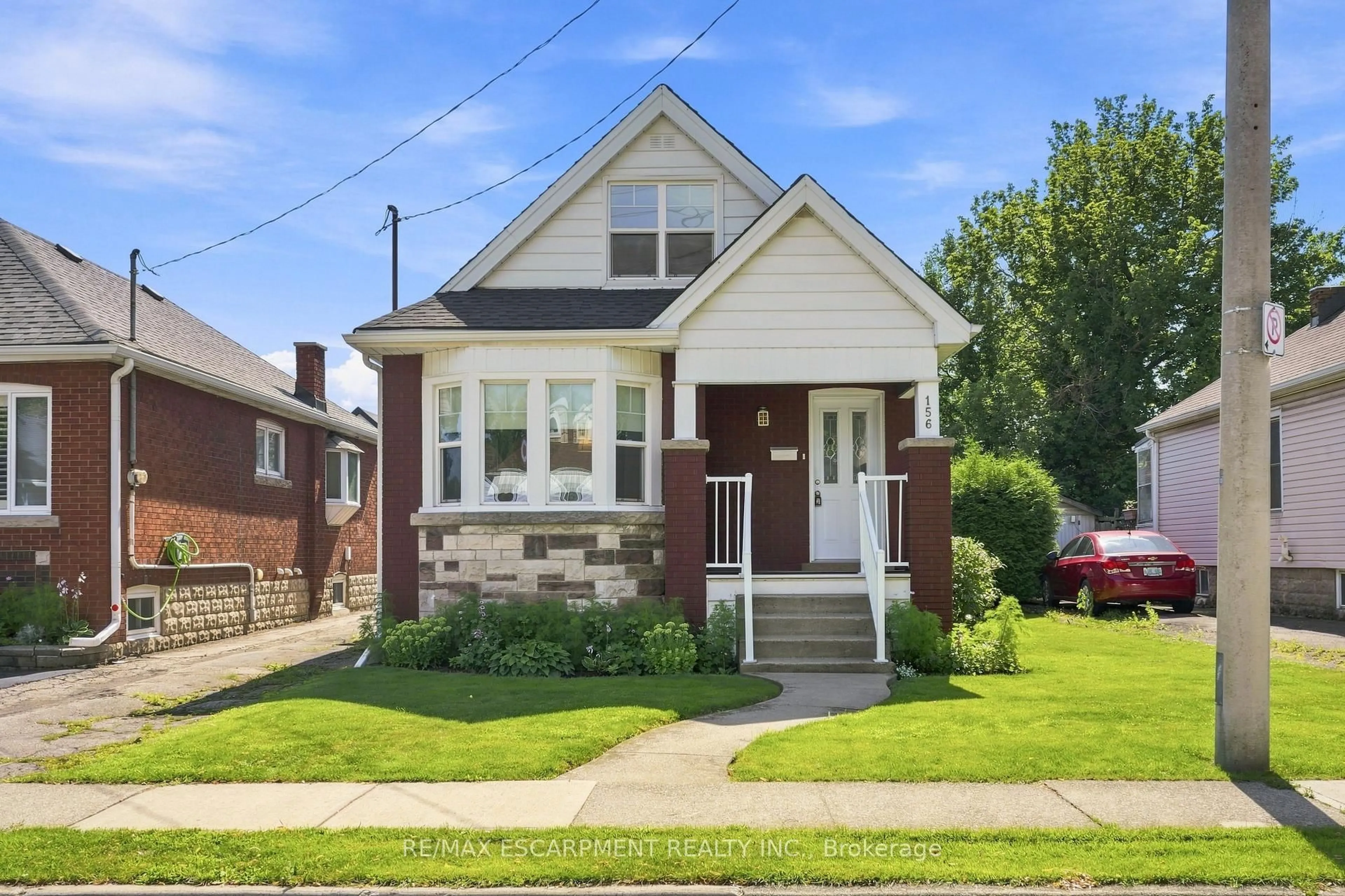 Home with brick exterior material, street for 156 Tragina Ave, Hamilton Ontario L8H 5C8