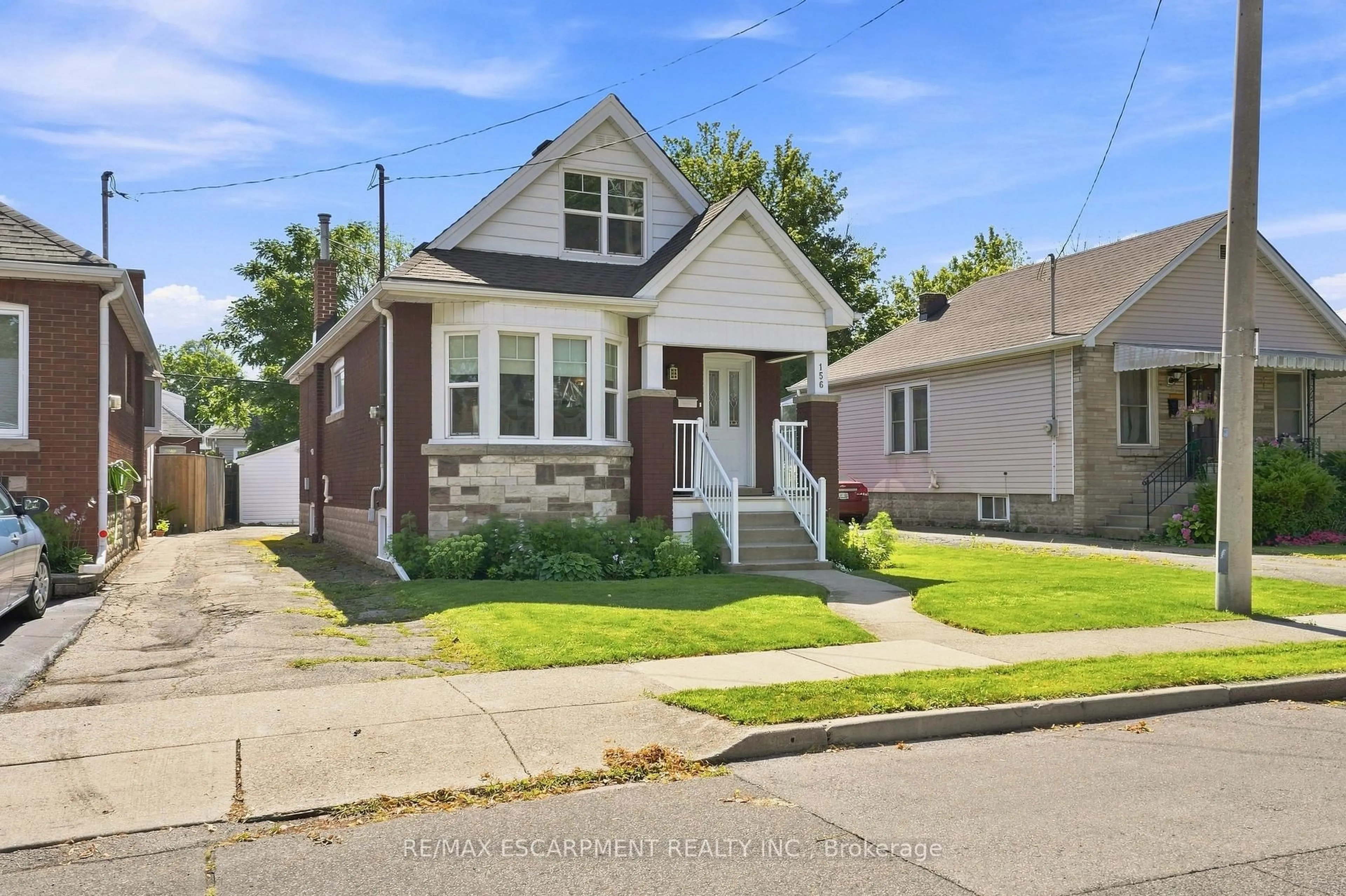 Home with brick exterior material, street for 156 Tragina Ave, Hamilton Ontario L8H 5C8