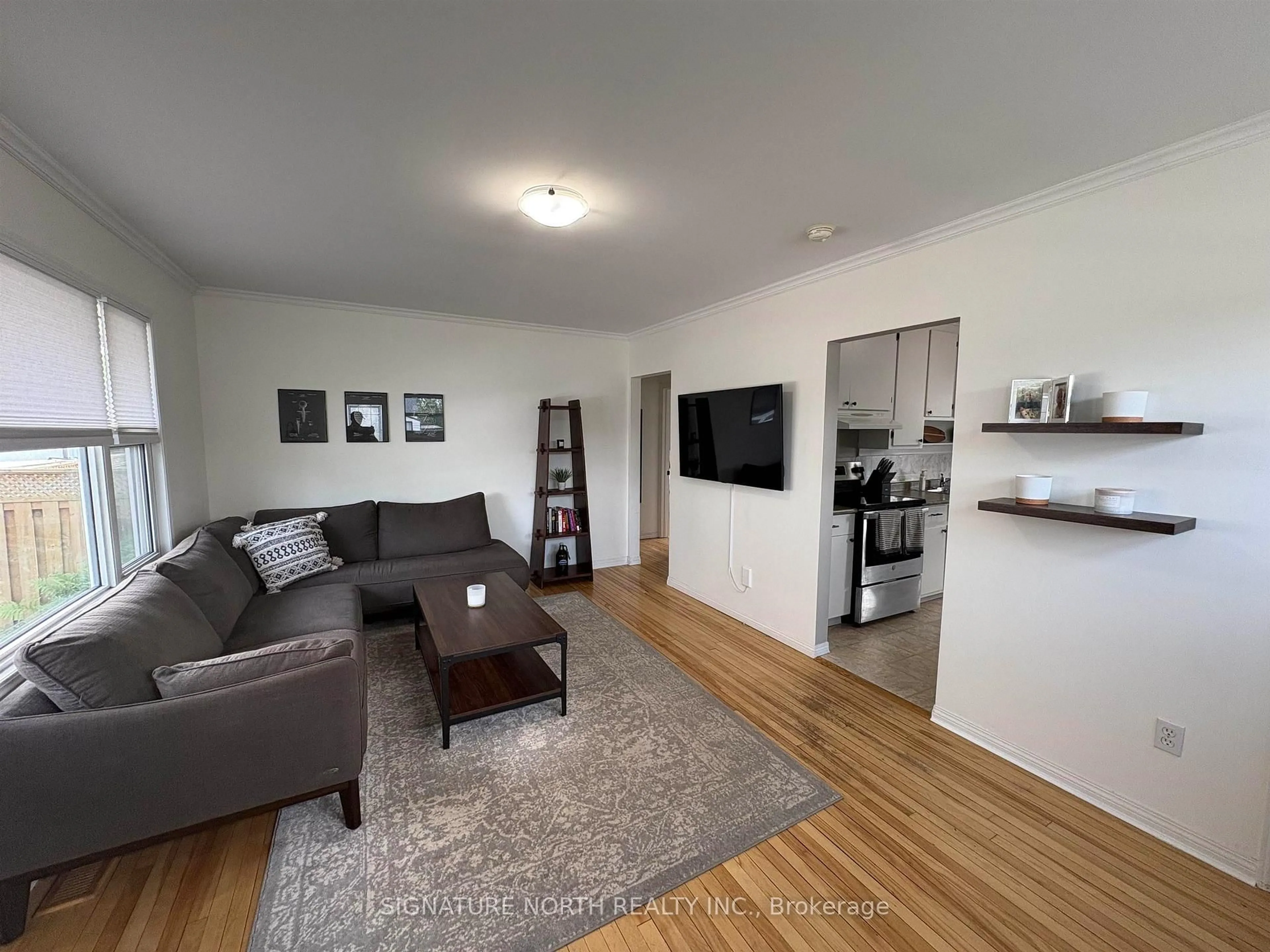 Living room with furniture, wood/laminate floor for 140 Christina St, Thunder Bay Ontario P7E 4N5