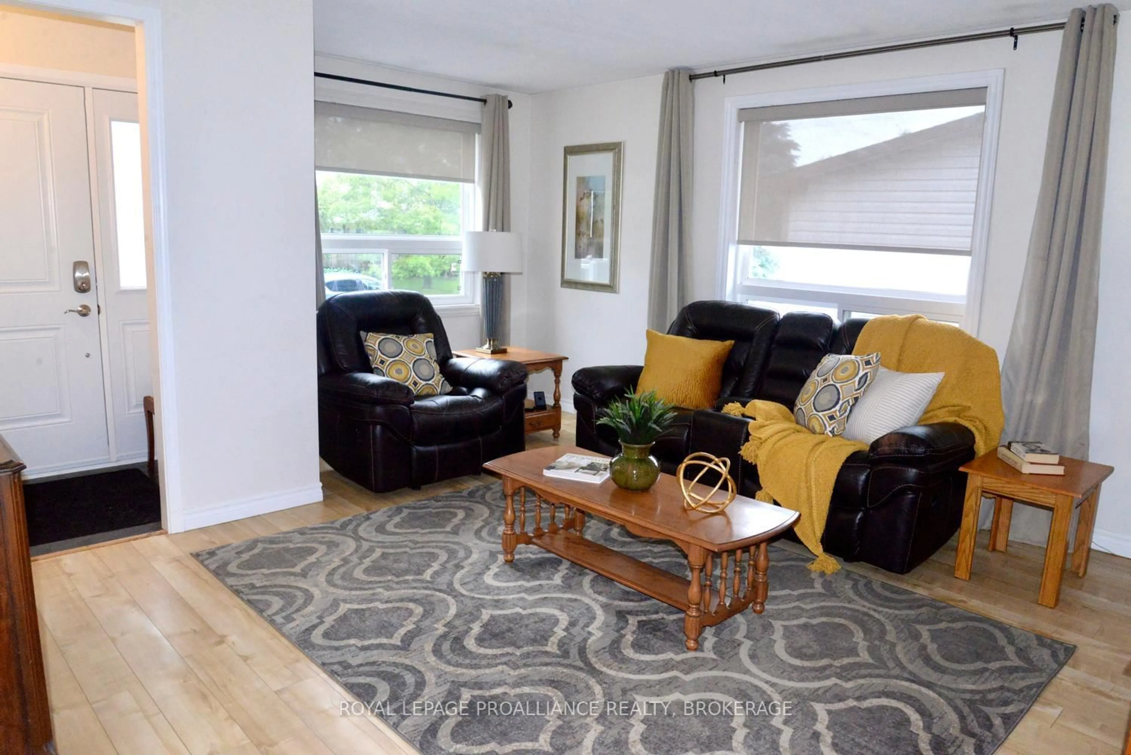 Living room with furniture, wood/laminate floor for 108 Elmwood Dr, Gananoque Ontario K7G 1N9