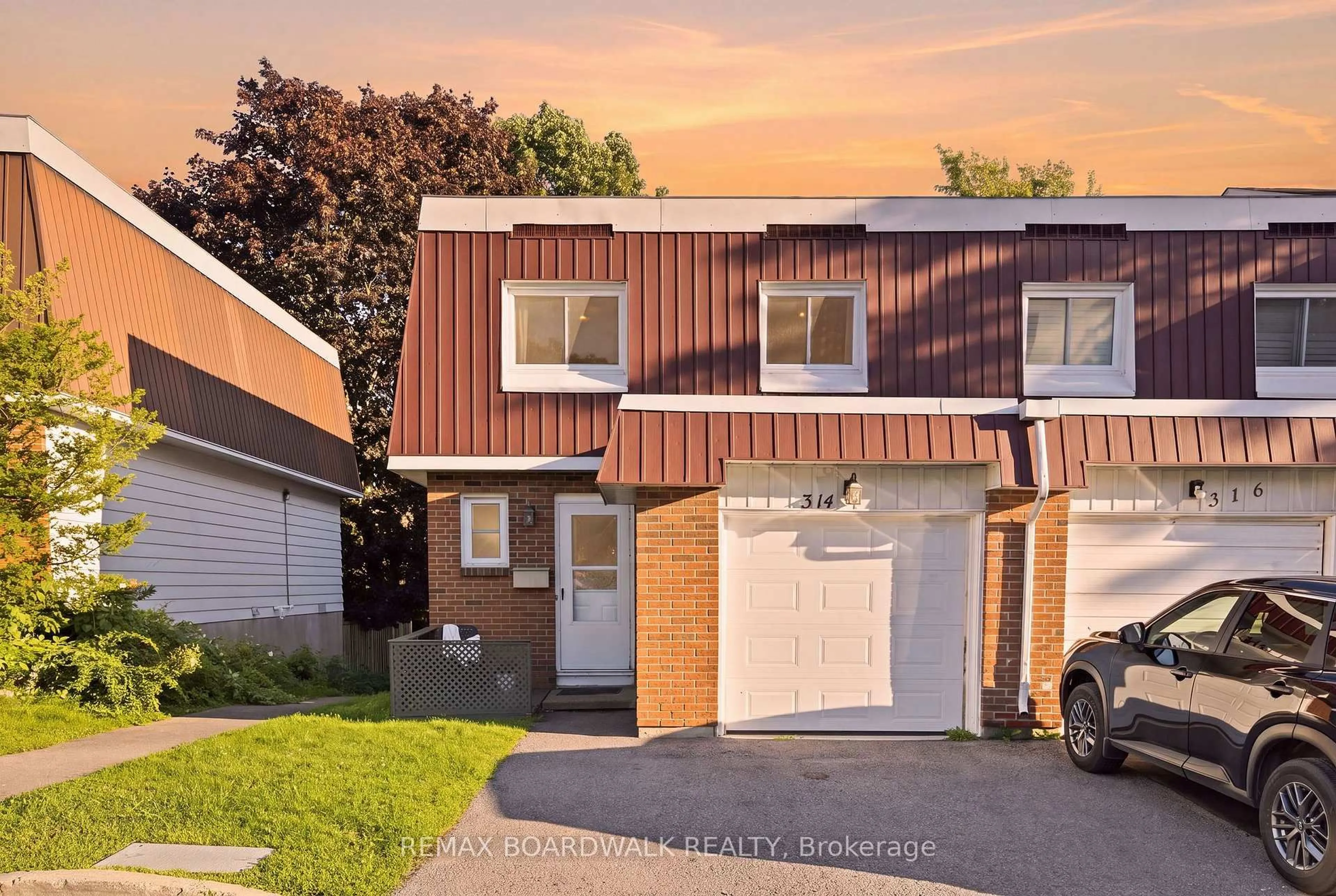 Home with brick exterior material, street for 314 Stone Quarry Private #14, Ottawa Ontario K1K 3Y2