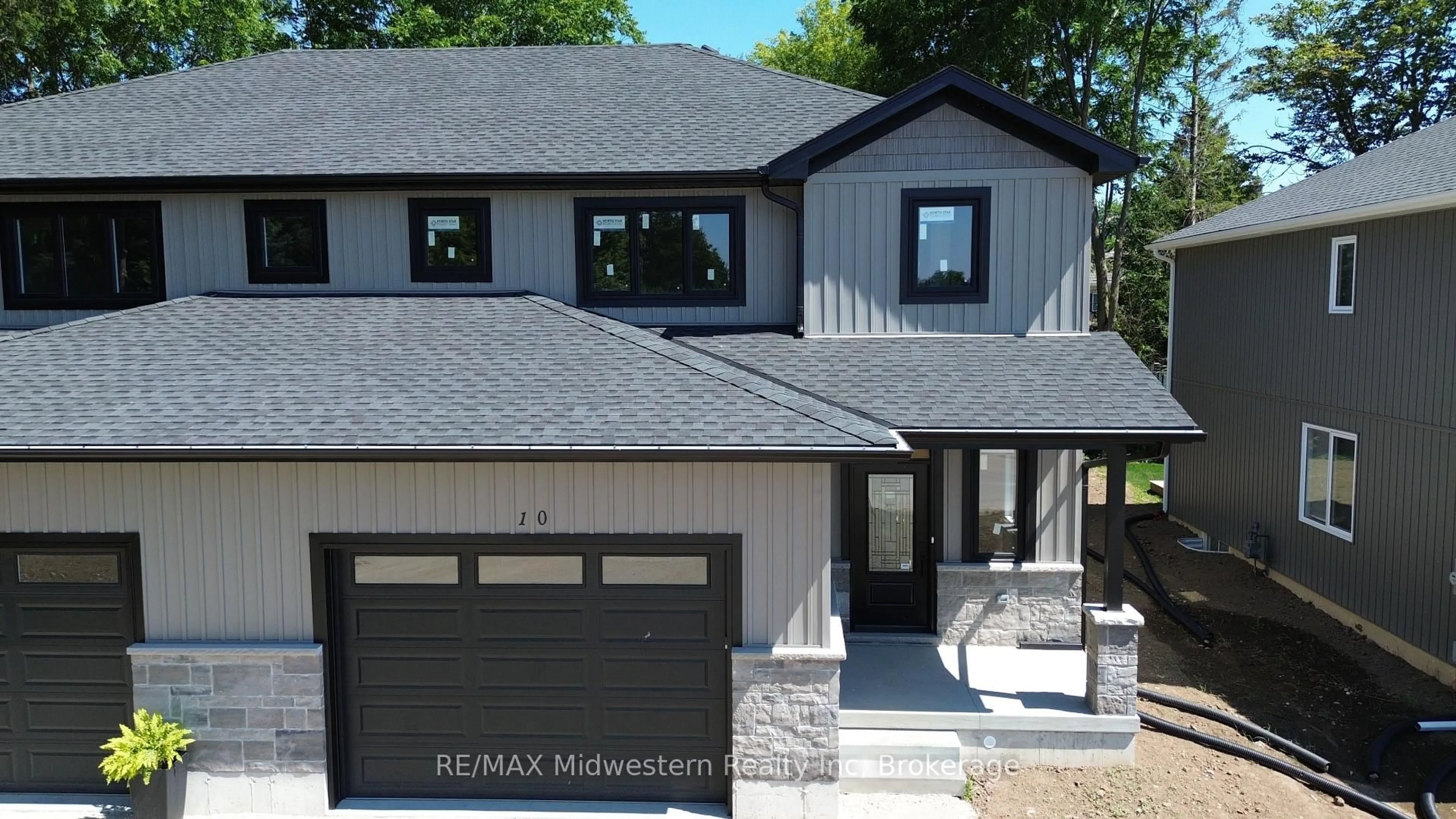 Home with vinyl exterior material, street for 10 Roberts St, Huron East Ontario N0K 1W0