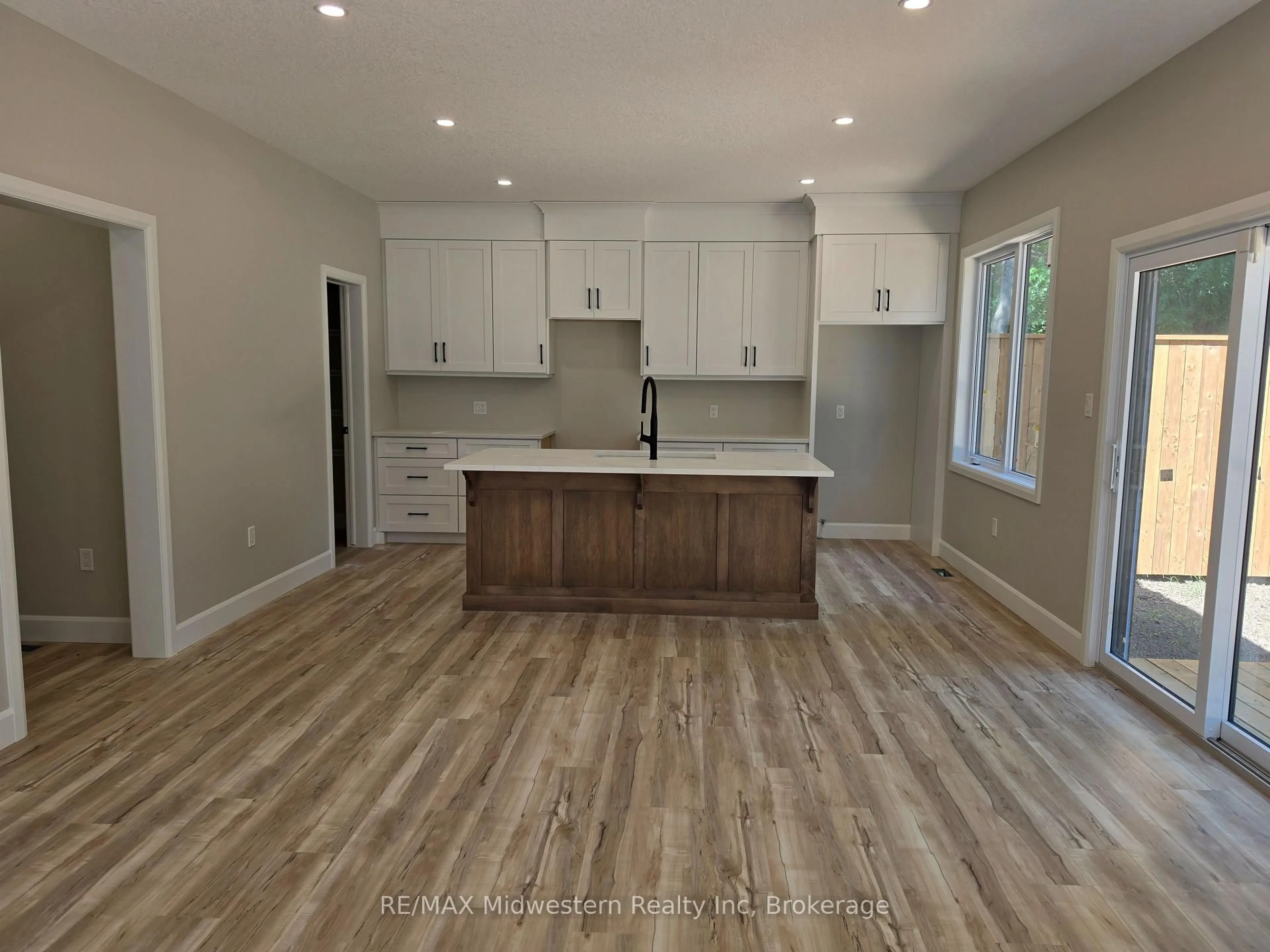 Open concept kitchen, wood/laminate floor for 10 Roberts St, Huron East Ontario N0K 1W0
