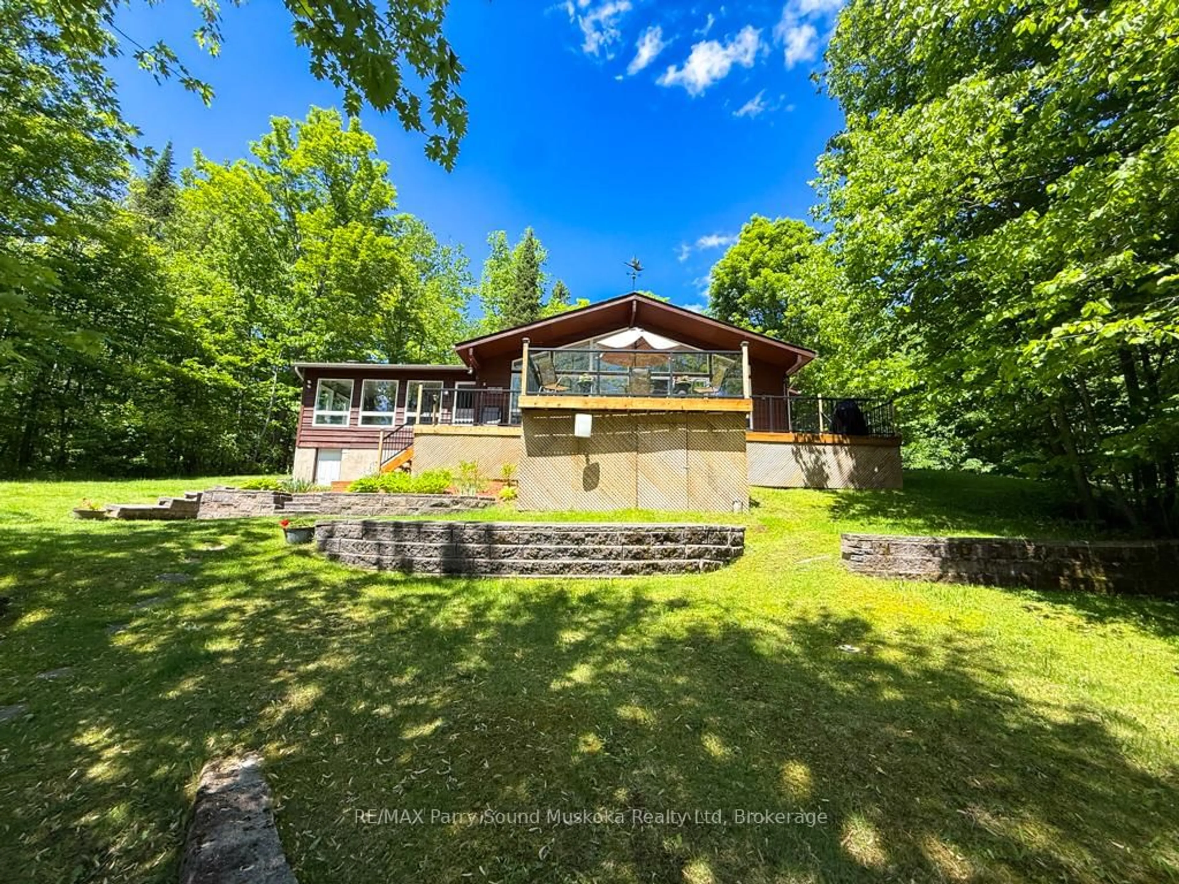 A pic from outside/outdoor area/front of a property/back of a property/a pic from drone, water/lake/river/ocean view for 17 Lizzie's Lane, McKellar Ontario P2A 0B4
