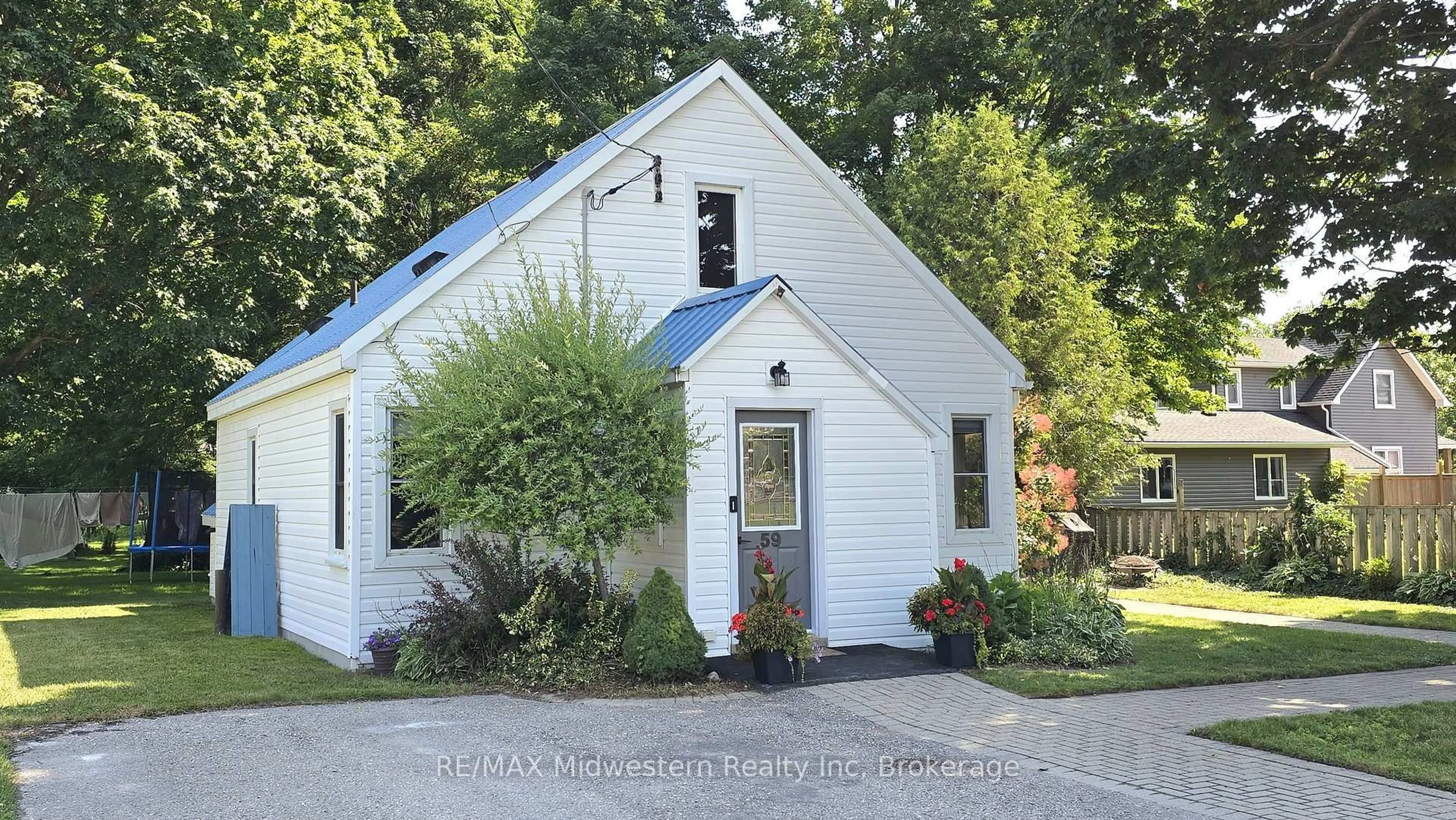 Home with vinyl exterior material, street for 59 Flora St, Huron East Ontario N0G 1H0