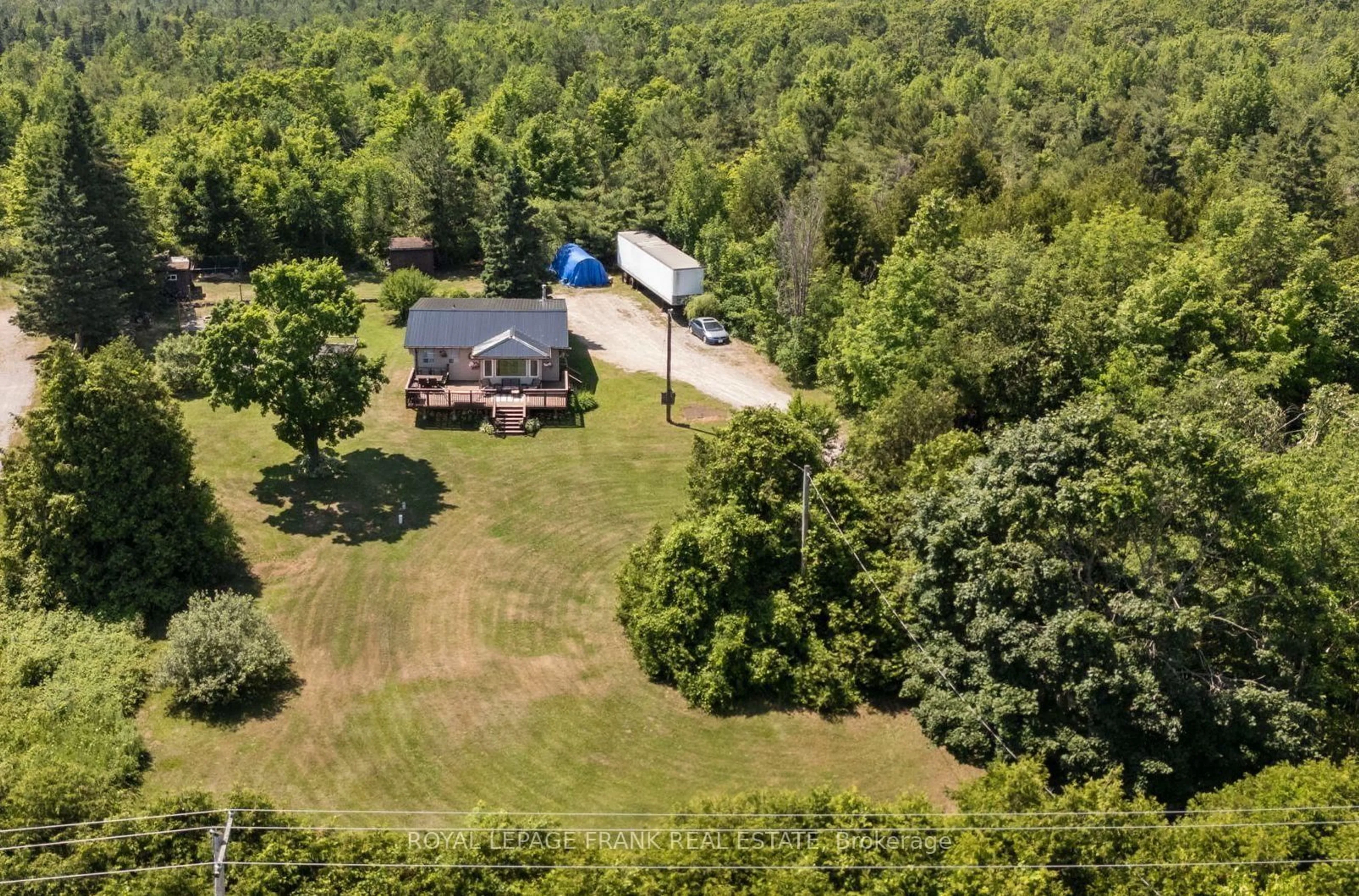 A pic from outside/outdoor area/front of a property/back of a property/a pic from drone, forest/trees view for 2378 Monck Rd, Kawartha Lakes Ontario K0M 2B0