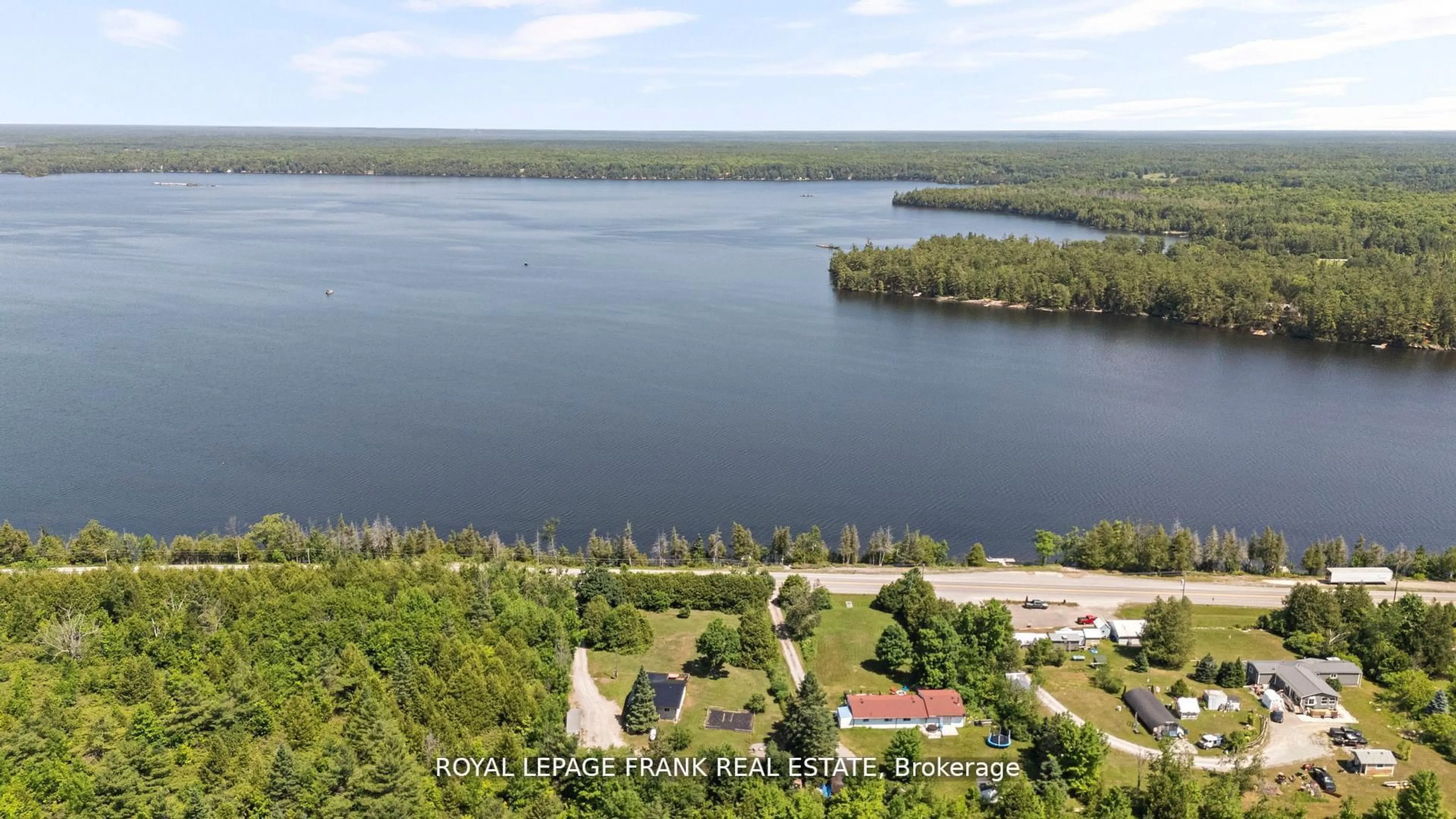 A pic from outside/outdoor area/front of a property/back of a property/a pic from drone, water/lake/river/ocean view for 2378 Monck Rd, Kawartha Lakes Ontario K0M 2B0