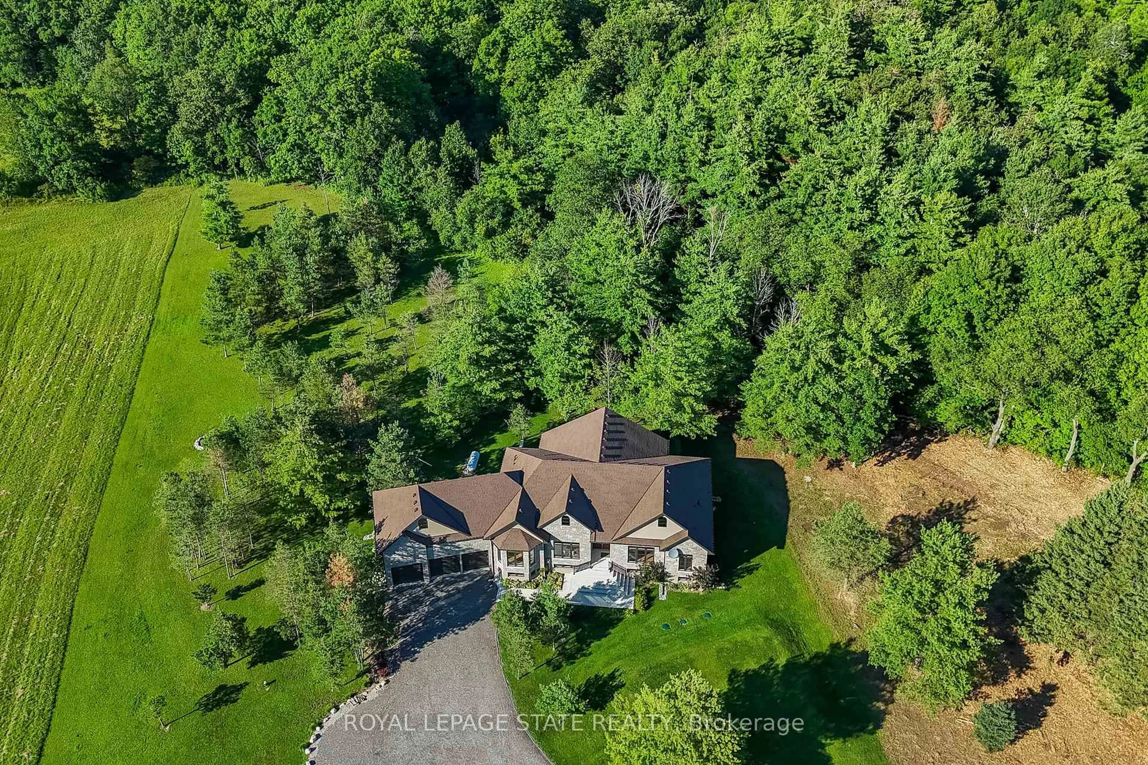 A pic from outside/outdoor area/front of a property/back of a property/a pic from drone, forest/trees view for 986 Highway 8, Hamilton Ontario L9H 5E1