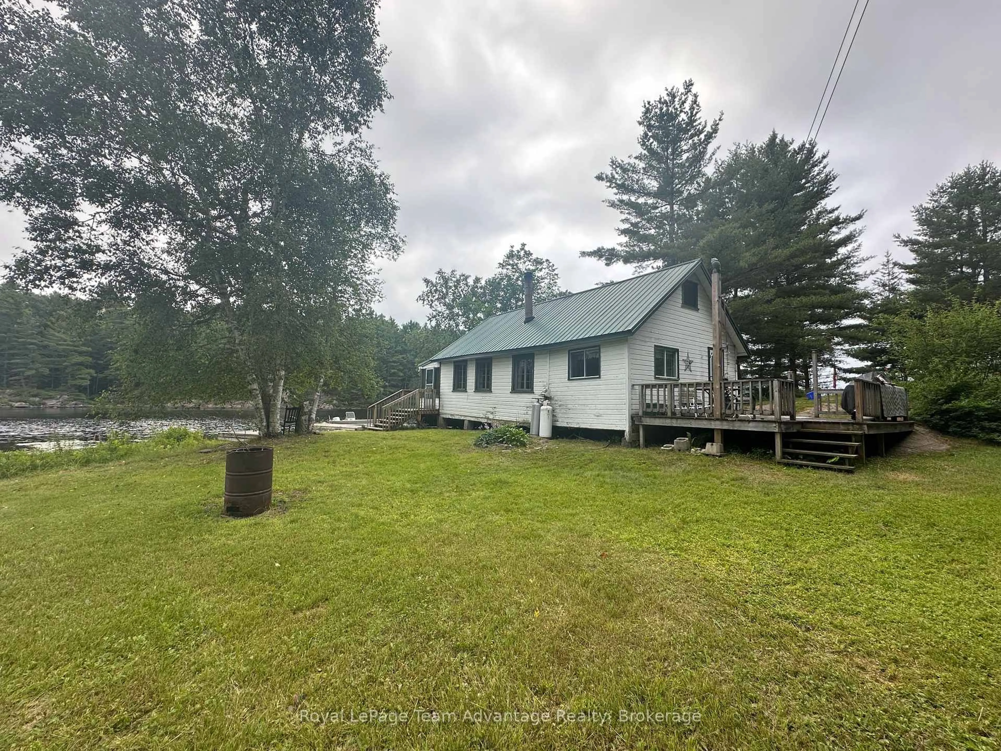 A pic from outside/outdoor area/front of a property/back of a property/a pic from drone, water/lake/river/ocean view for 9130 Harris Lake WA, Whitestone Ontario P0A 1G0