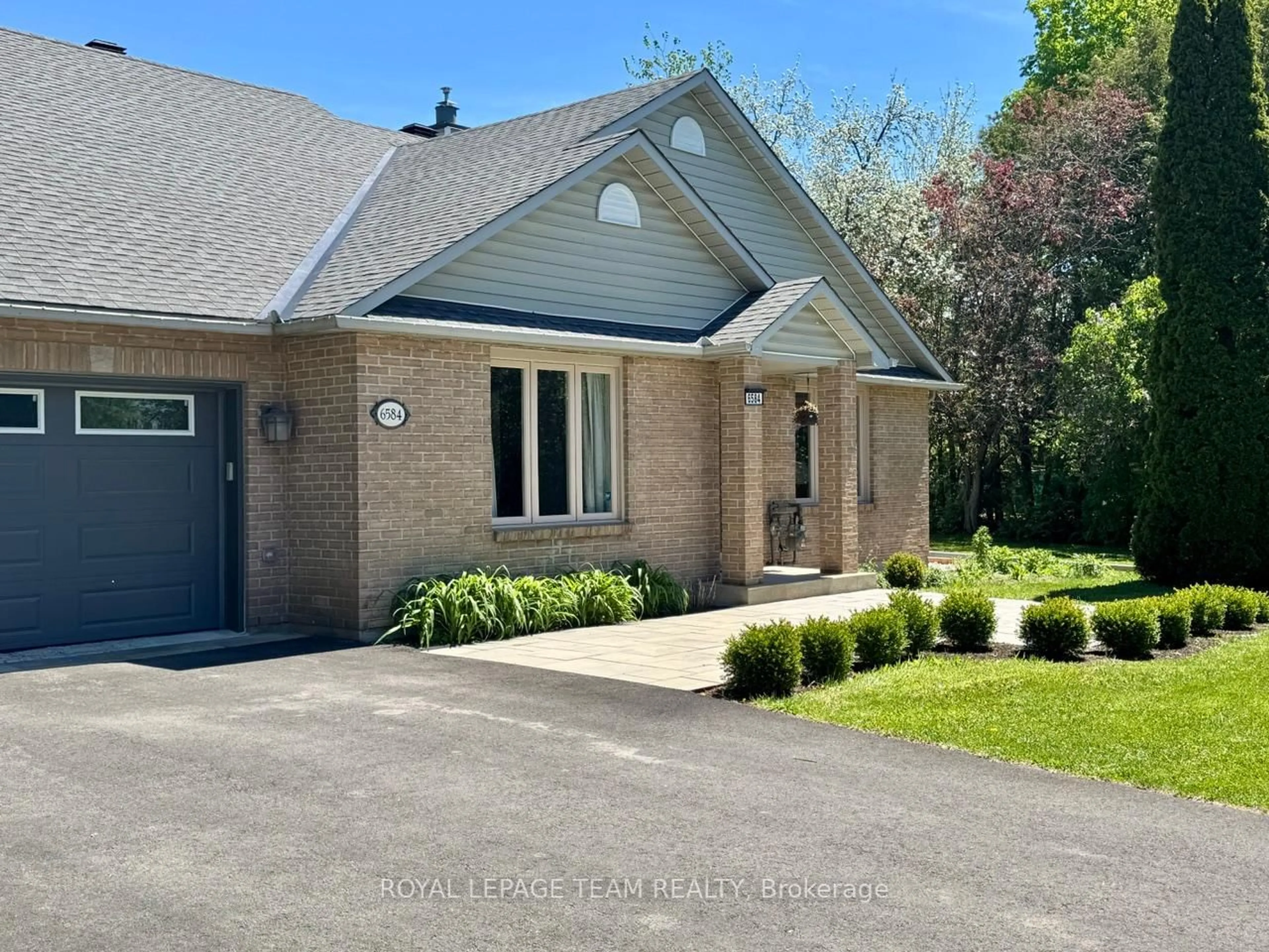 Home with brick exterior material, street for 6584 Harvest Grove Dr, Ottawa Ontario K4P 1E9