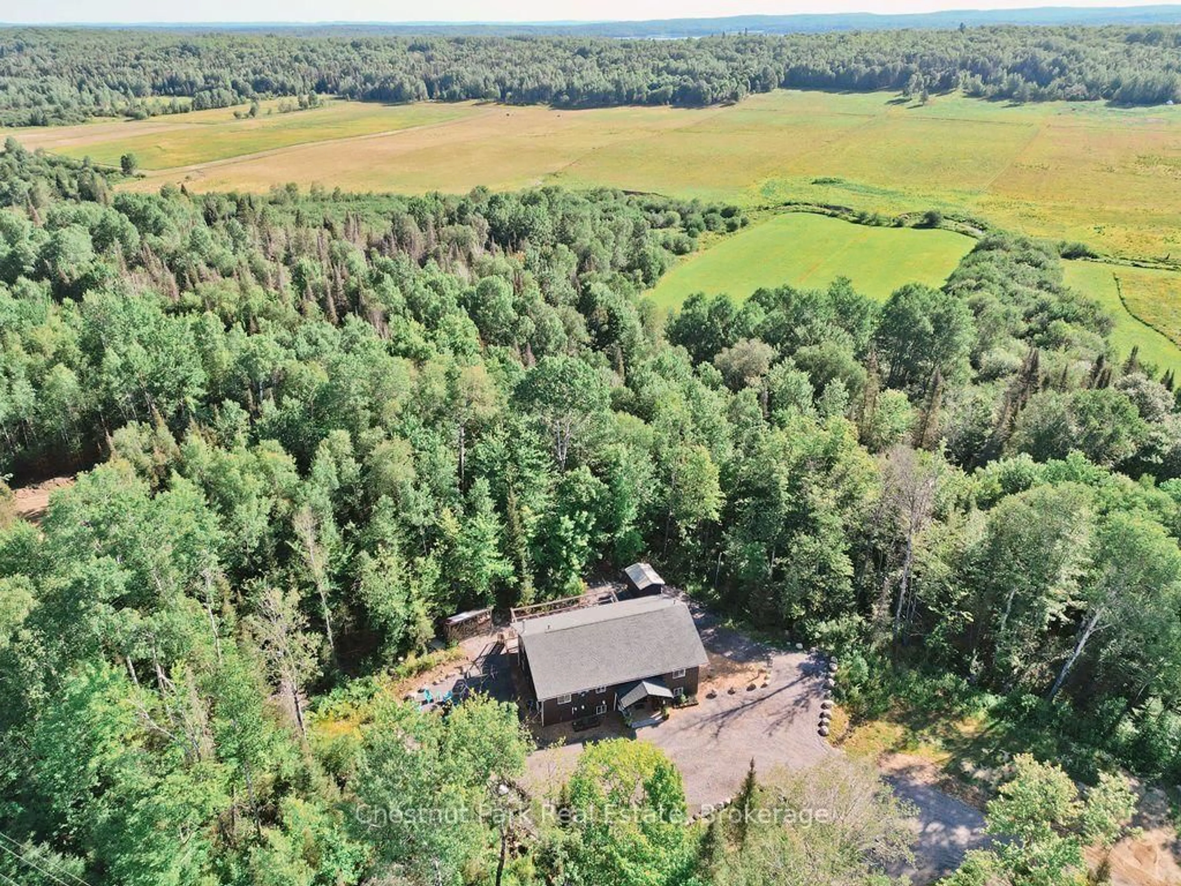 A pic from outside/outdoor area/front of a property/back of a property/a pic from drone, forest/trees view for 1170 Alderdale Rd, Powassan Ontario P0H 1Z0