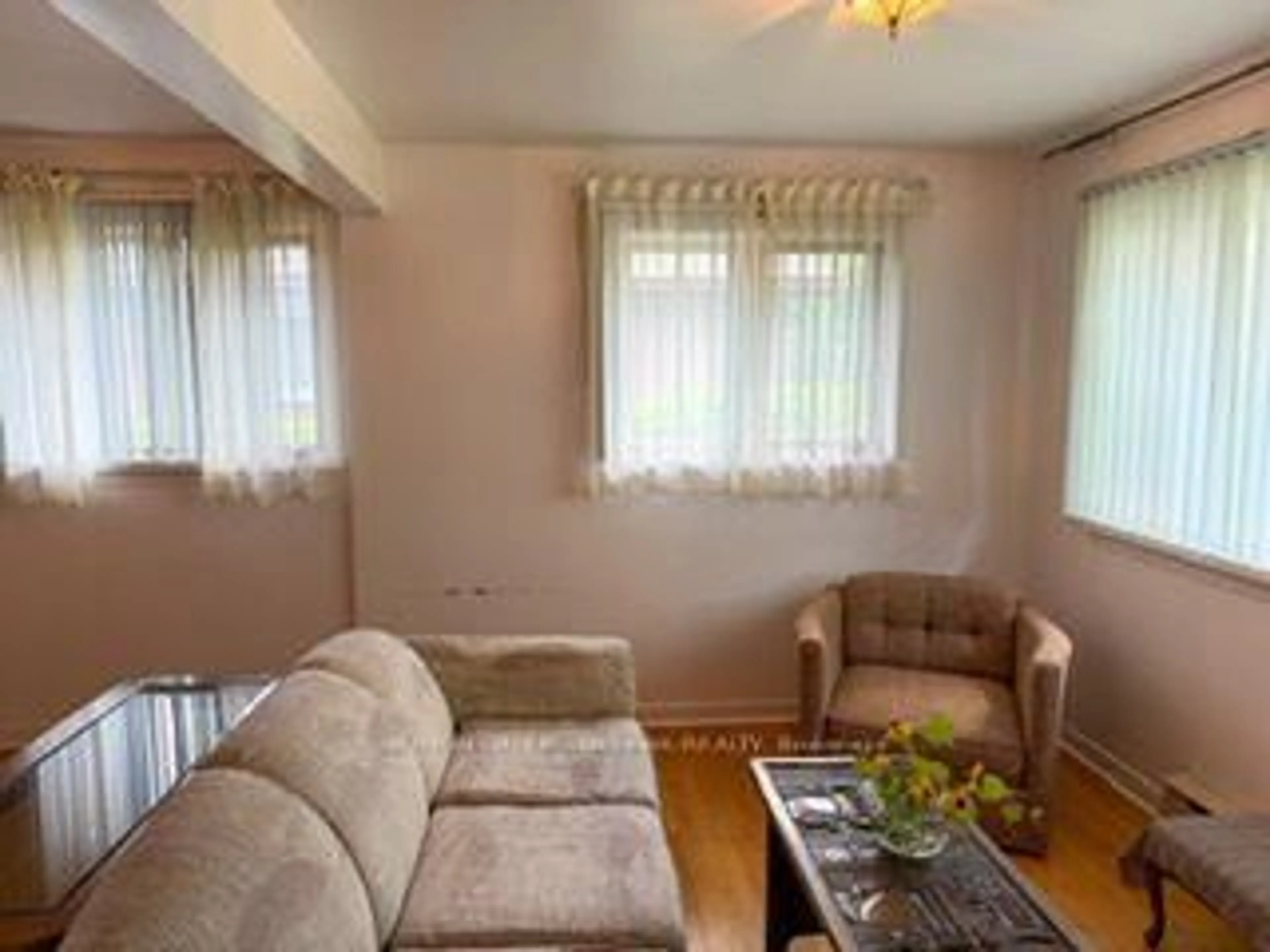 Living room with furniture, wood/laminate floor for 767 Claude St, Ottawa Ontario K1K 2S1
