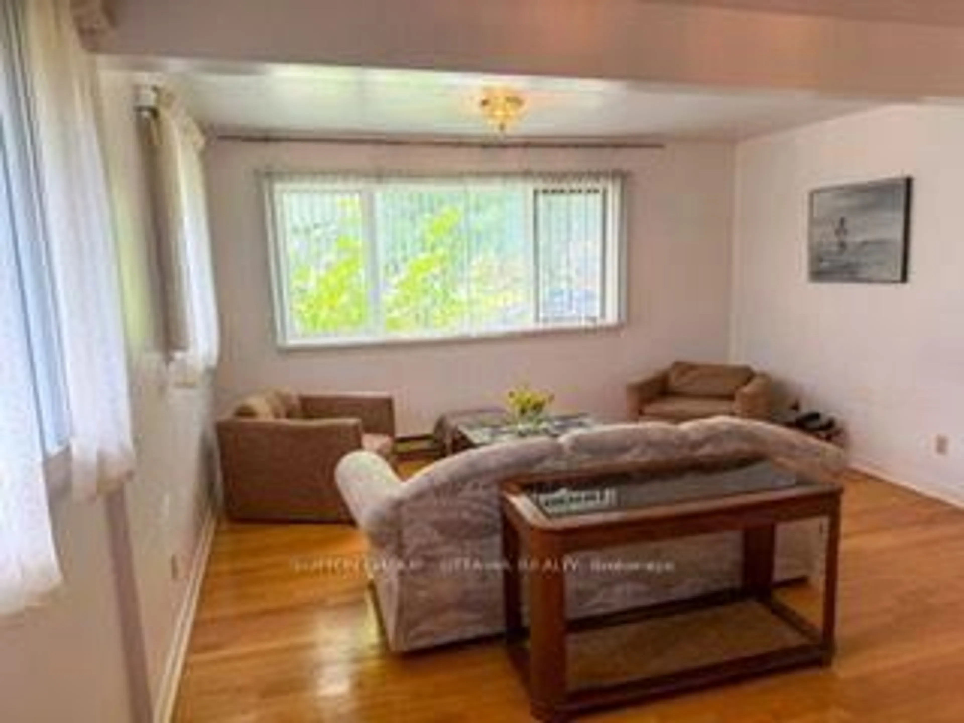 Living room with furniture, wood/laminate floor for 767 Claude St, Ottawa Ontario K1K 2S1