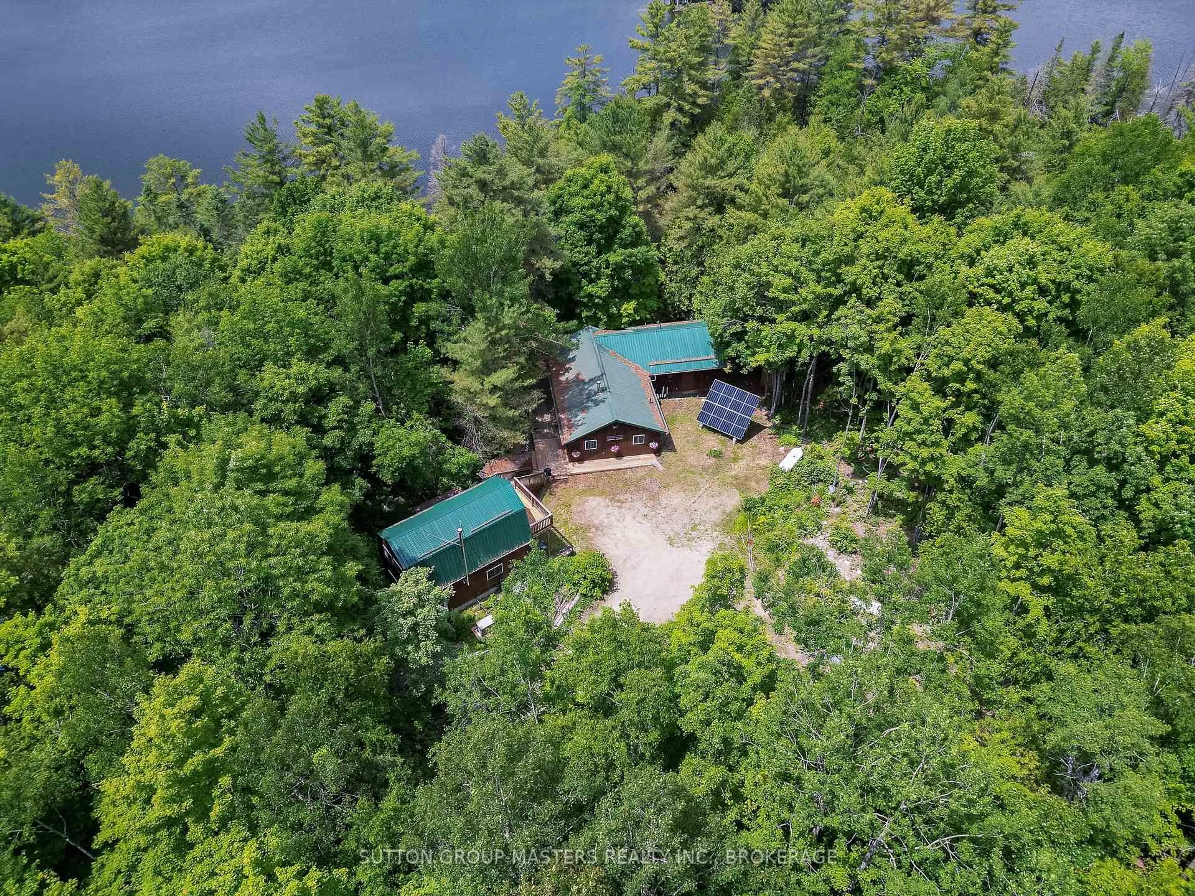 A pic from outside/outdoor area/front of a property/back of a property/a pic from drone, water/lake/river/ocean view for 313 Raccoon Lake Trail Rd, Kaladar Ontario K0H 1Z0
