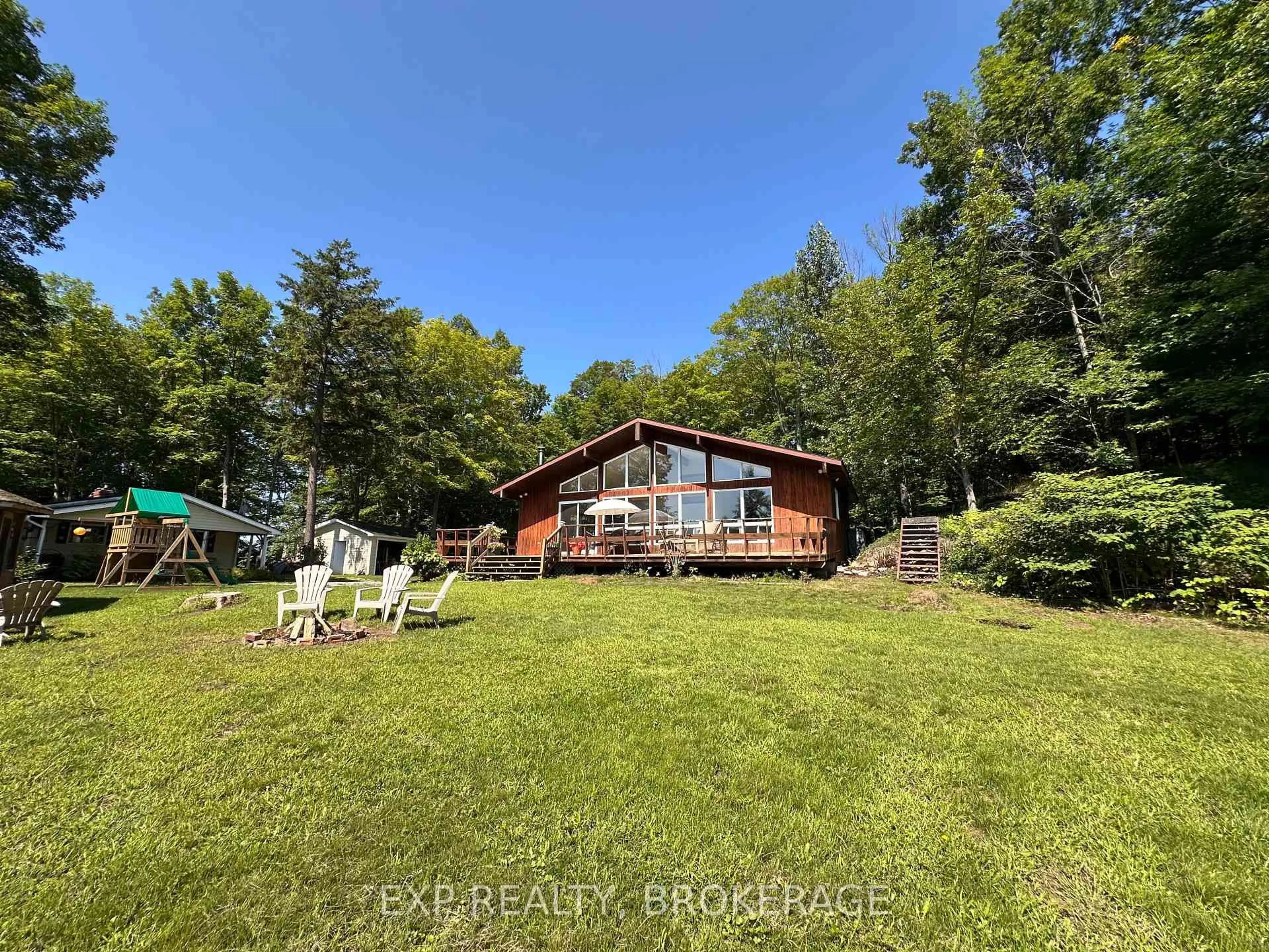 A pic from outside/outdoor area/front of a property/back of a property/a pic from drone, water/lake/river/ocean view for 2103 Hambly Lane, Hartington Ontario K0H 1W0
