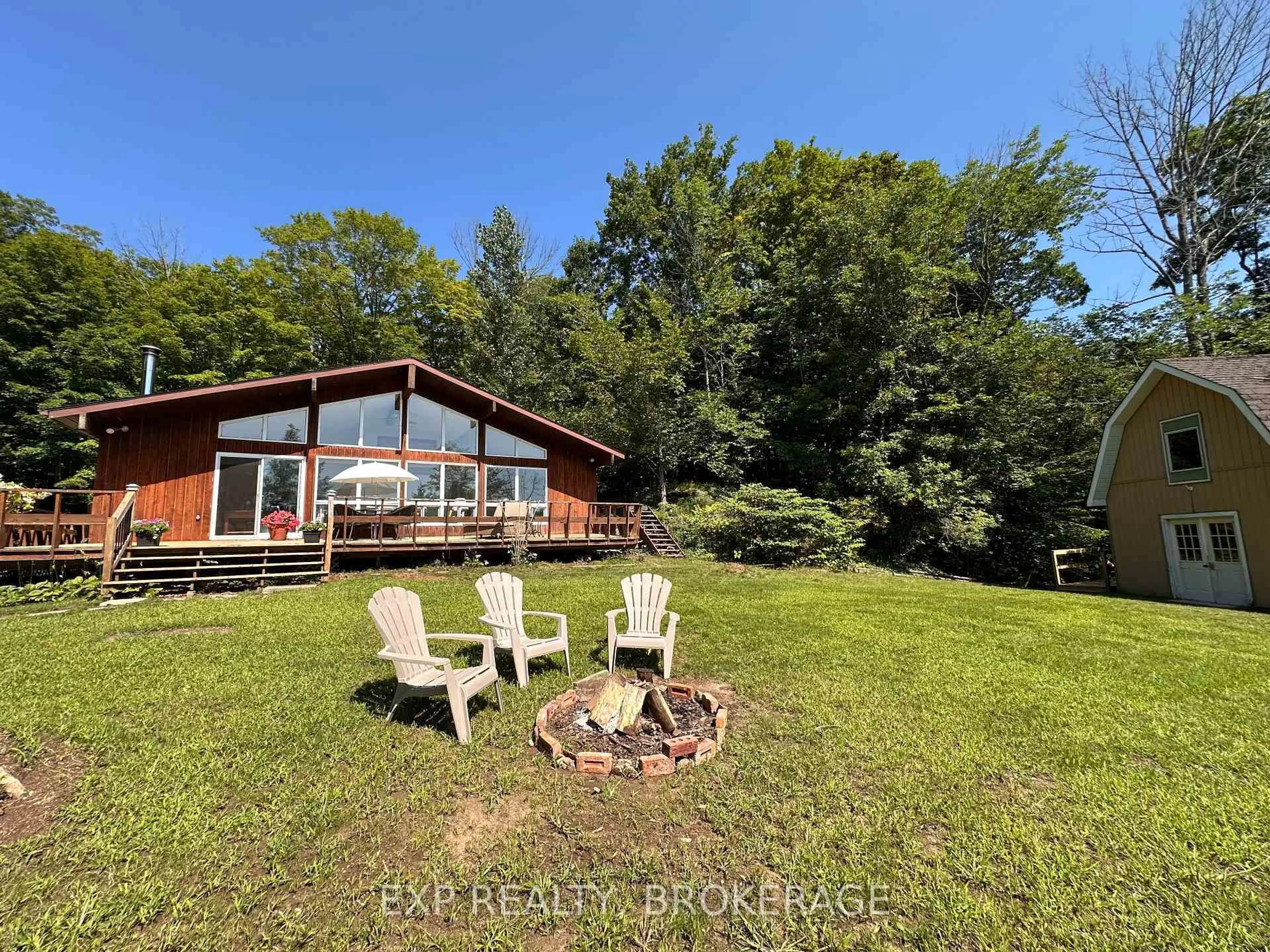 A pic from outside/outdoor area/front of a property/back of a property/a pic from drone, water/lake/river/ocean view for 2103 Hambly Lane, Hartington Ontario K0H 1W0