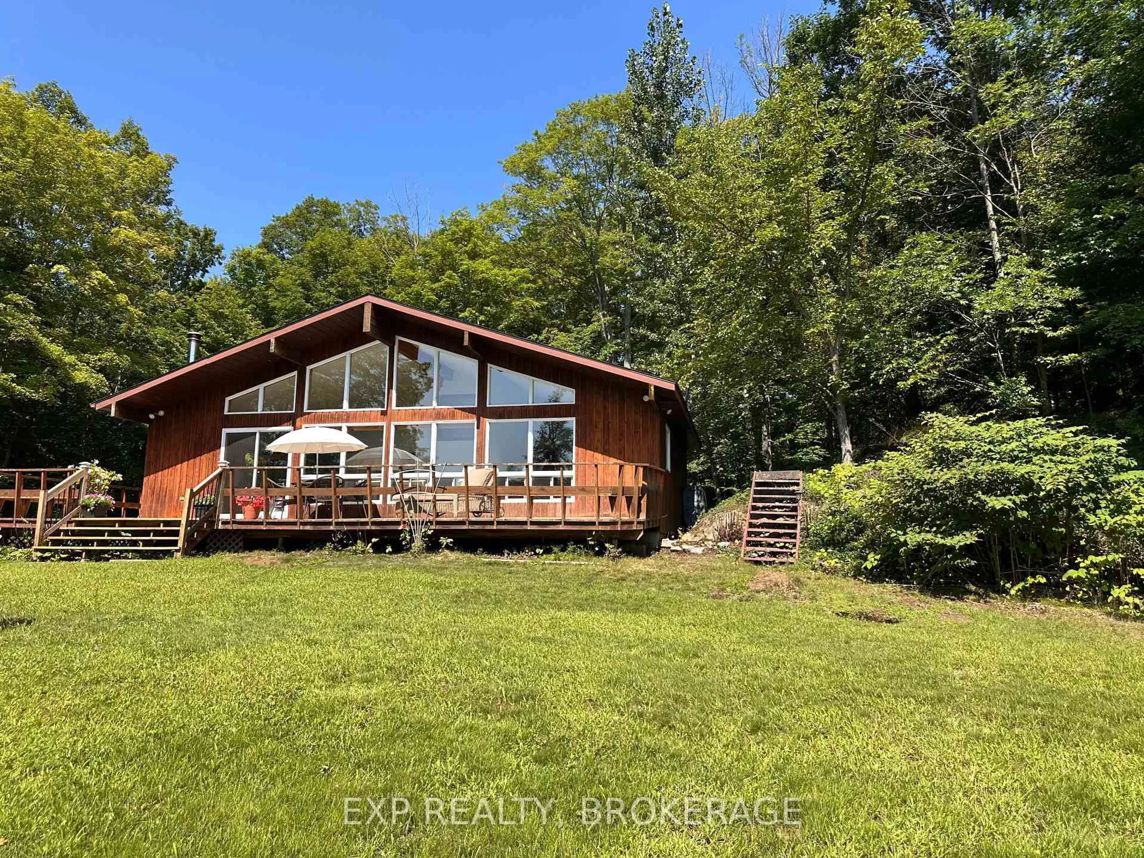 A pic from outside/outdoor area/front of a property/back of a property/a pic from drone, water/lake/river/ocean view for 2103 Hambly Lane, Hartington Ontario K0H 1W0