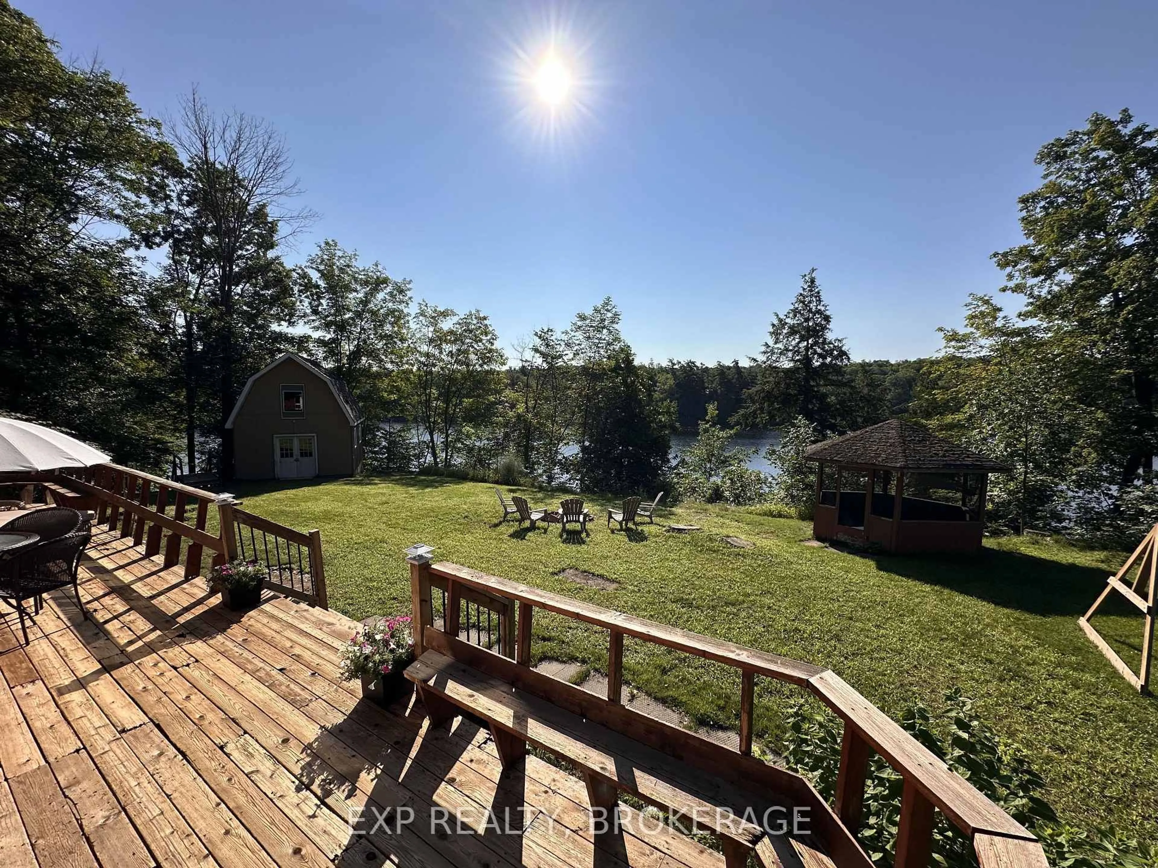A pic from outside/outdoor area/front of a property/back of a property/a pic from drone, water/lake/river/ocean view for 2103 Hambly Lane, Hartington Ontario K0H 1W0