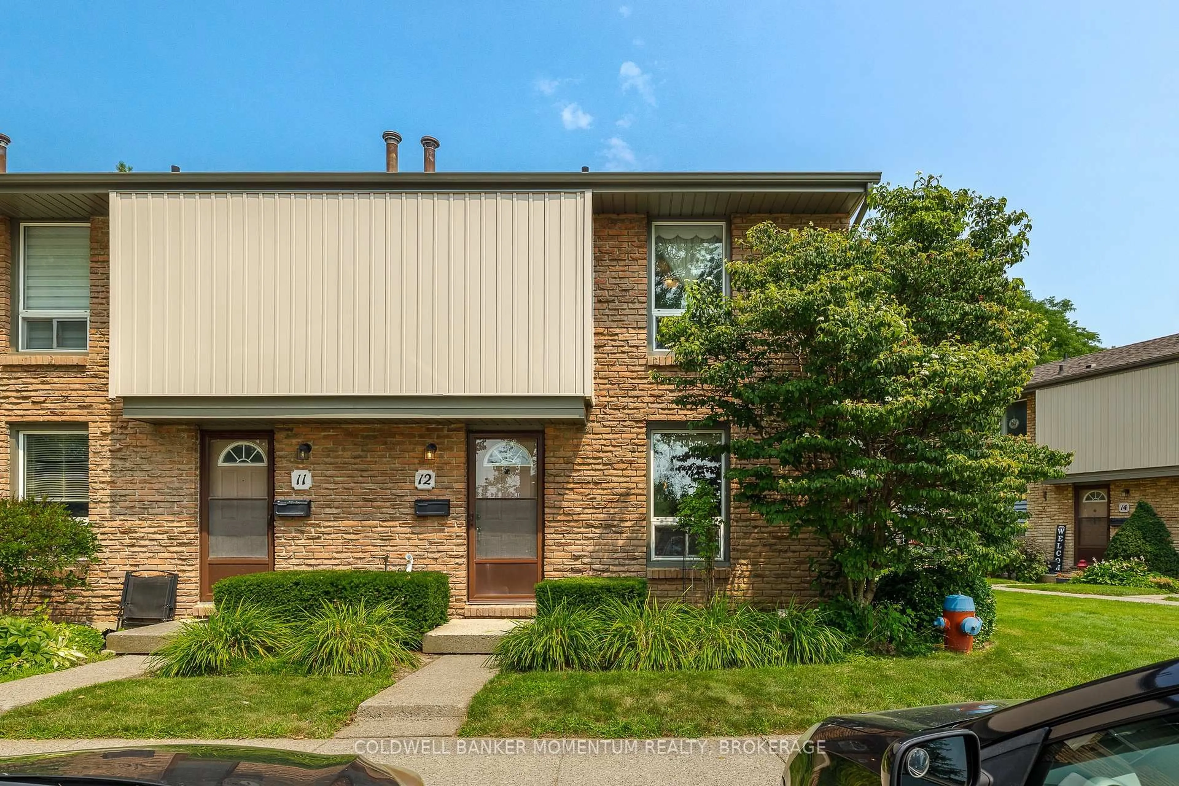 Home with brick exterior material, street for 302 Vine St #12, St. Catharines Ontario L2M 7M6