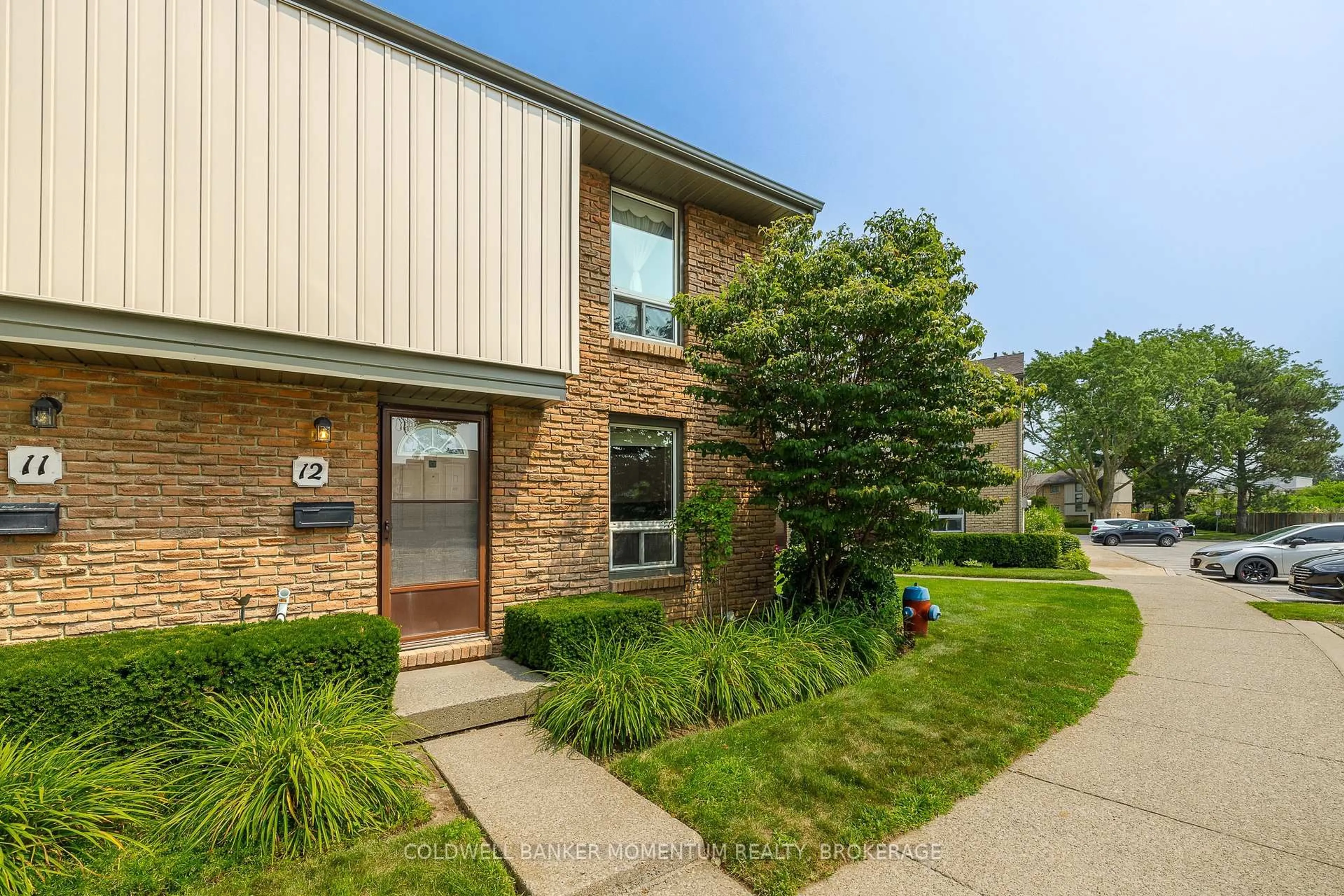 Home with brick exterior material, street for 302 Vine St #12, St. Catharines Ontario L2M 7M6