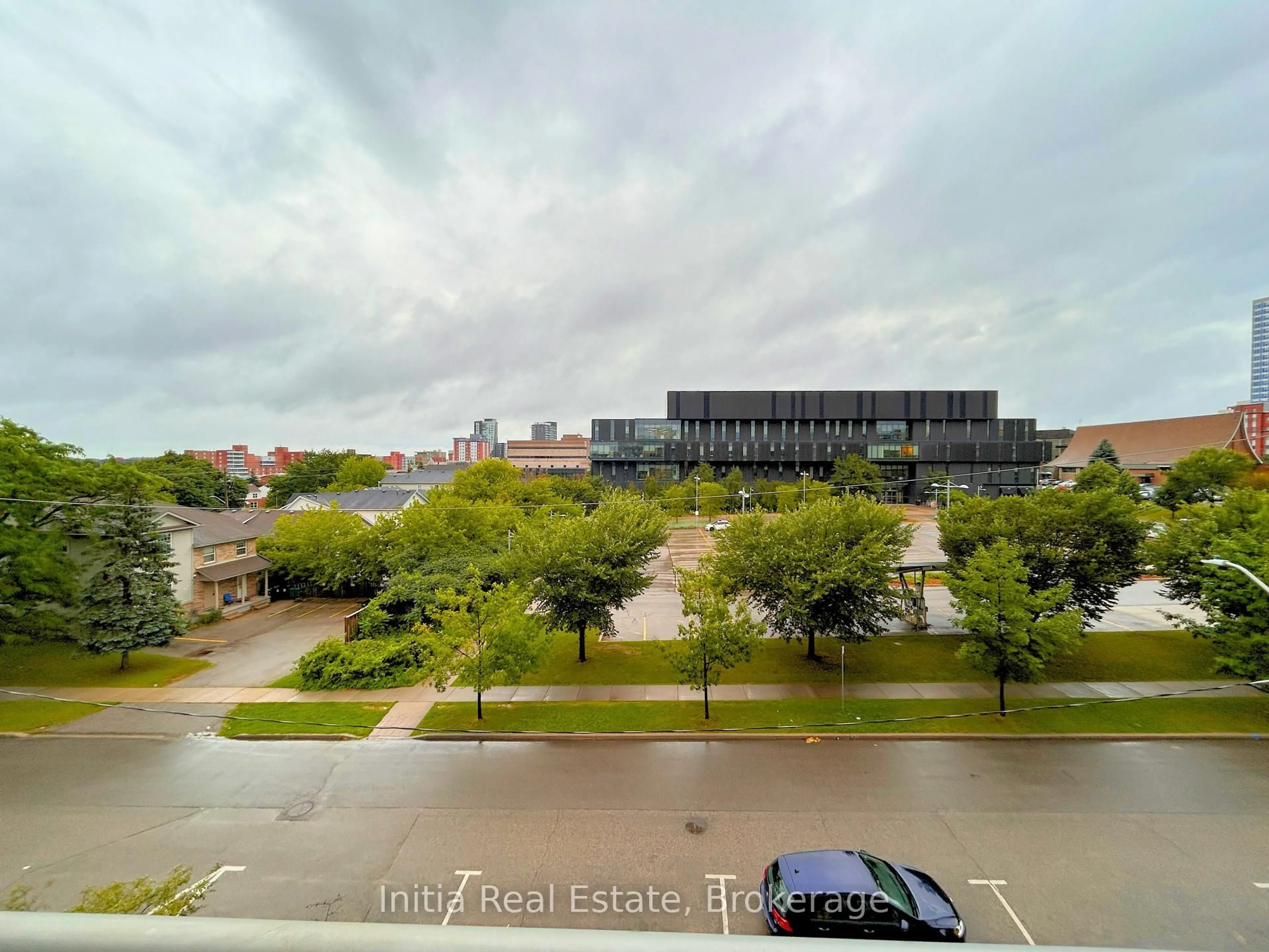 A pic from outside/outdoor area/front of a property/back of a property/a pic from drone, city buildings view from balcony for 62 Balsam St #B303, Waterloo Ontario N2L 3H2