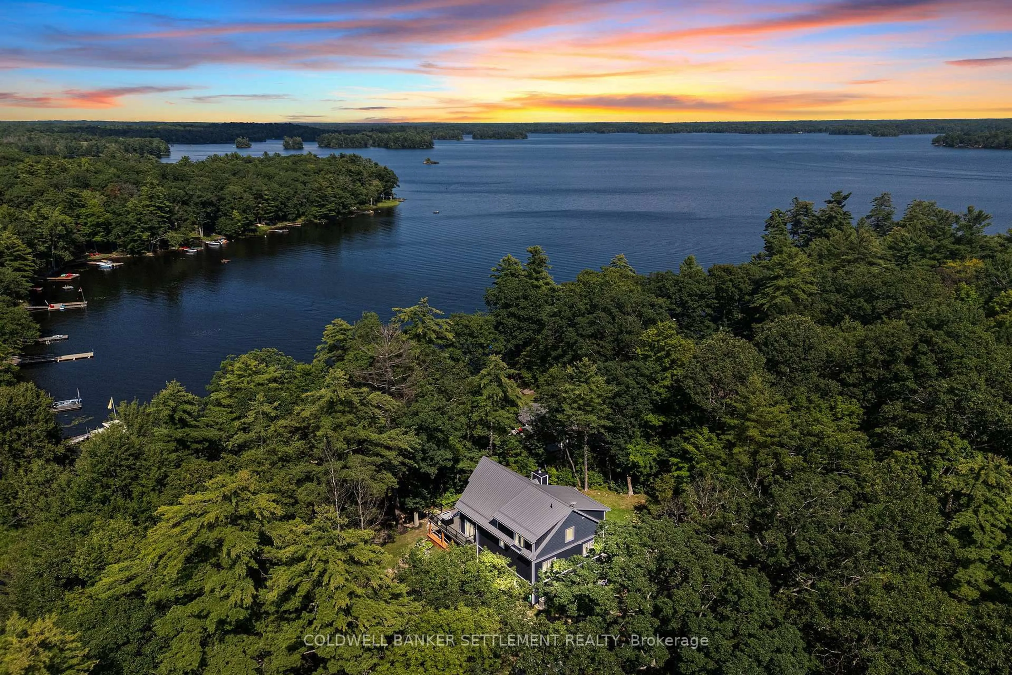 A pic from outside/outdoor area/front of a property/back of a property/a pic from drone, water/lake/river/ocean view for 97 Oak Haven Lane, Tichborne Ontario K0H 2V0