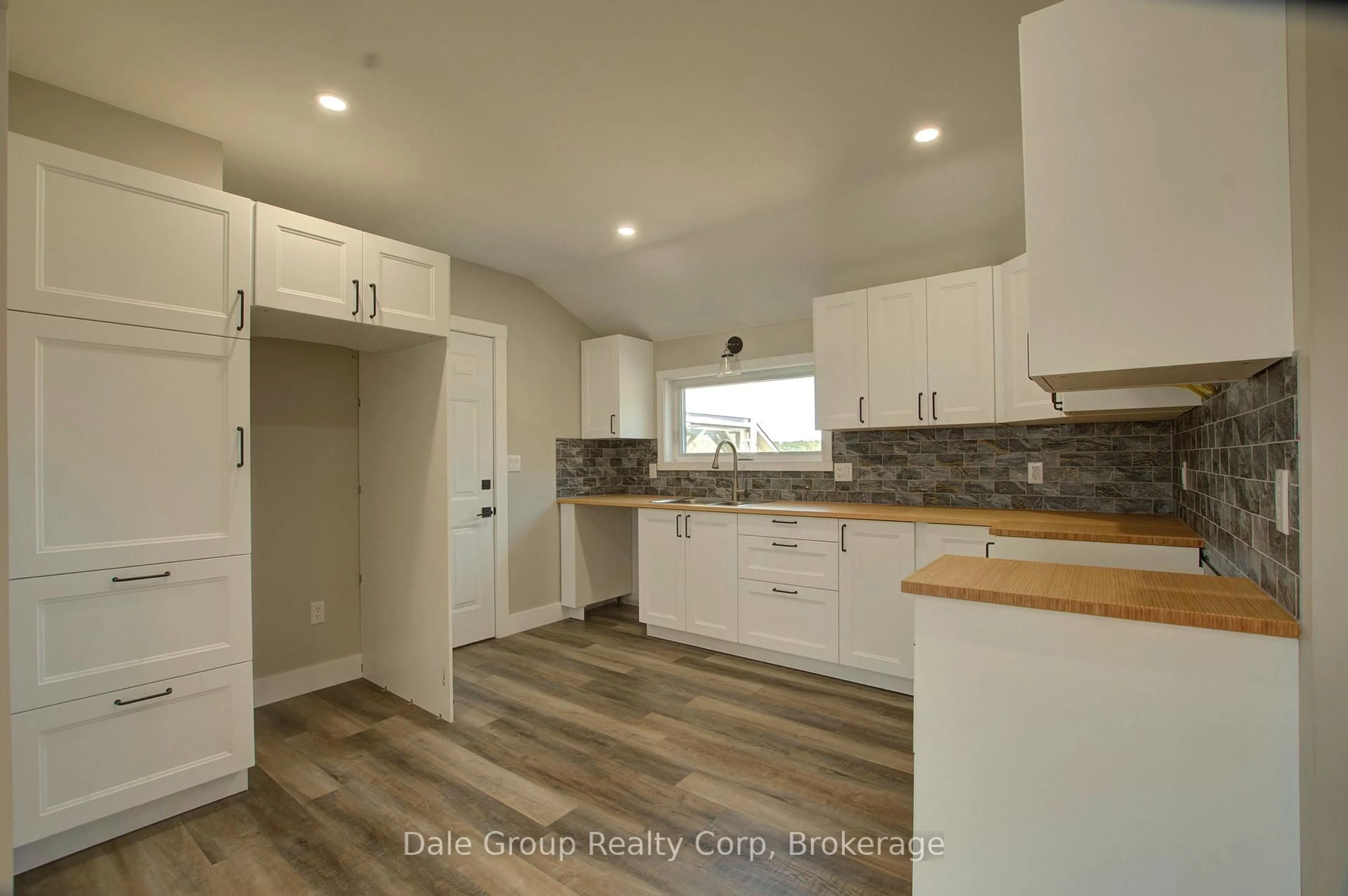 Open concept kitchen, wood/laminate floor for 293 Albert St, Central Huron Ontario N0M 1L0