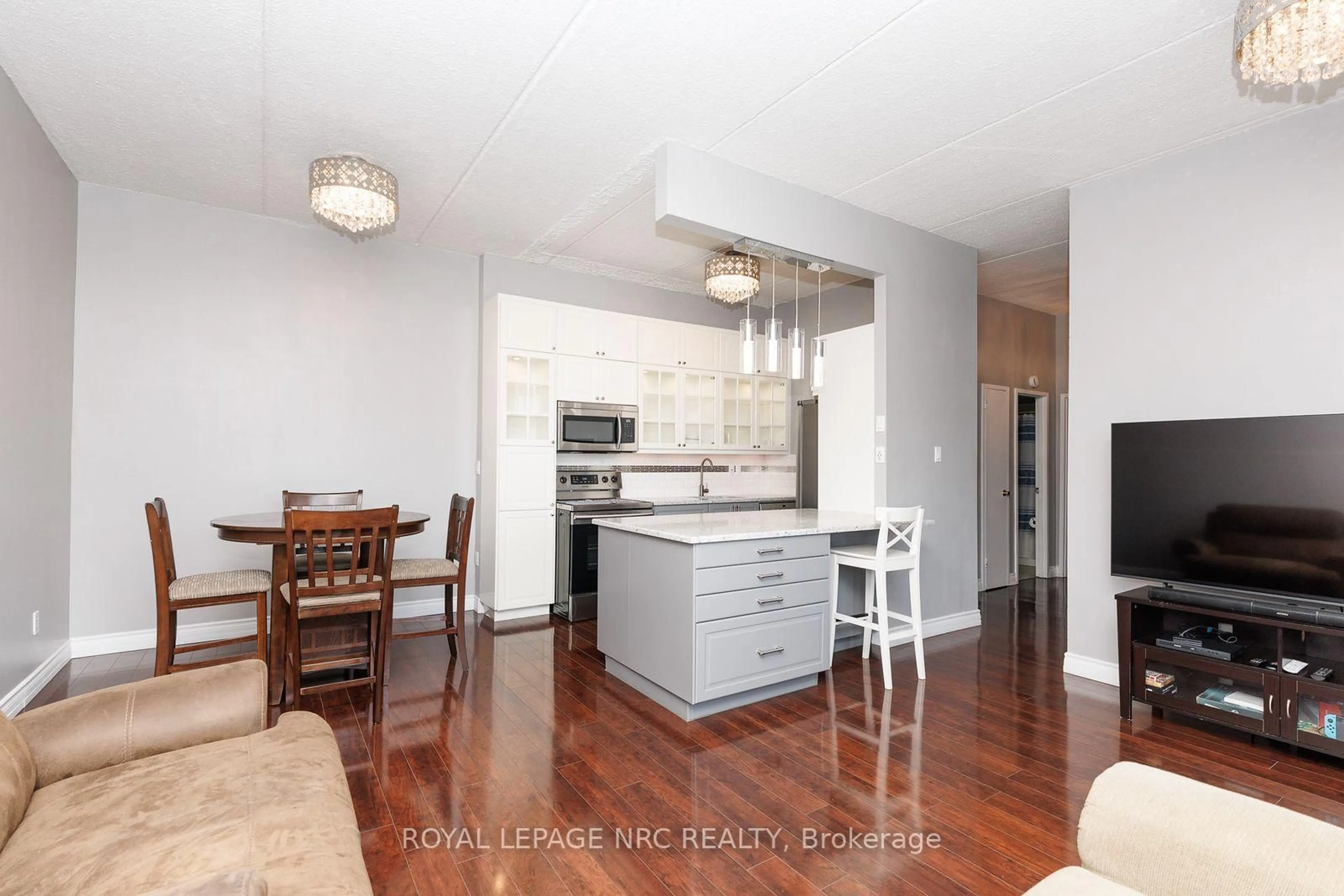 Open concept kitchen, wood/laminate floor for 196 Scott St #515, St. Catharines Ontario L2N 5T2