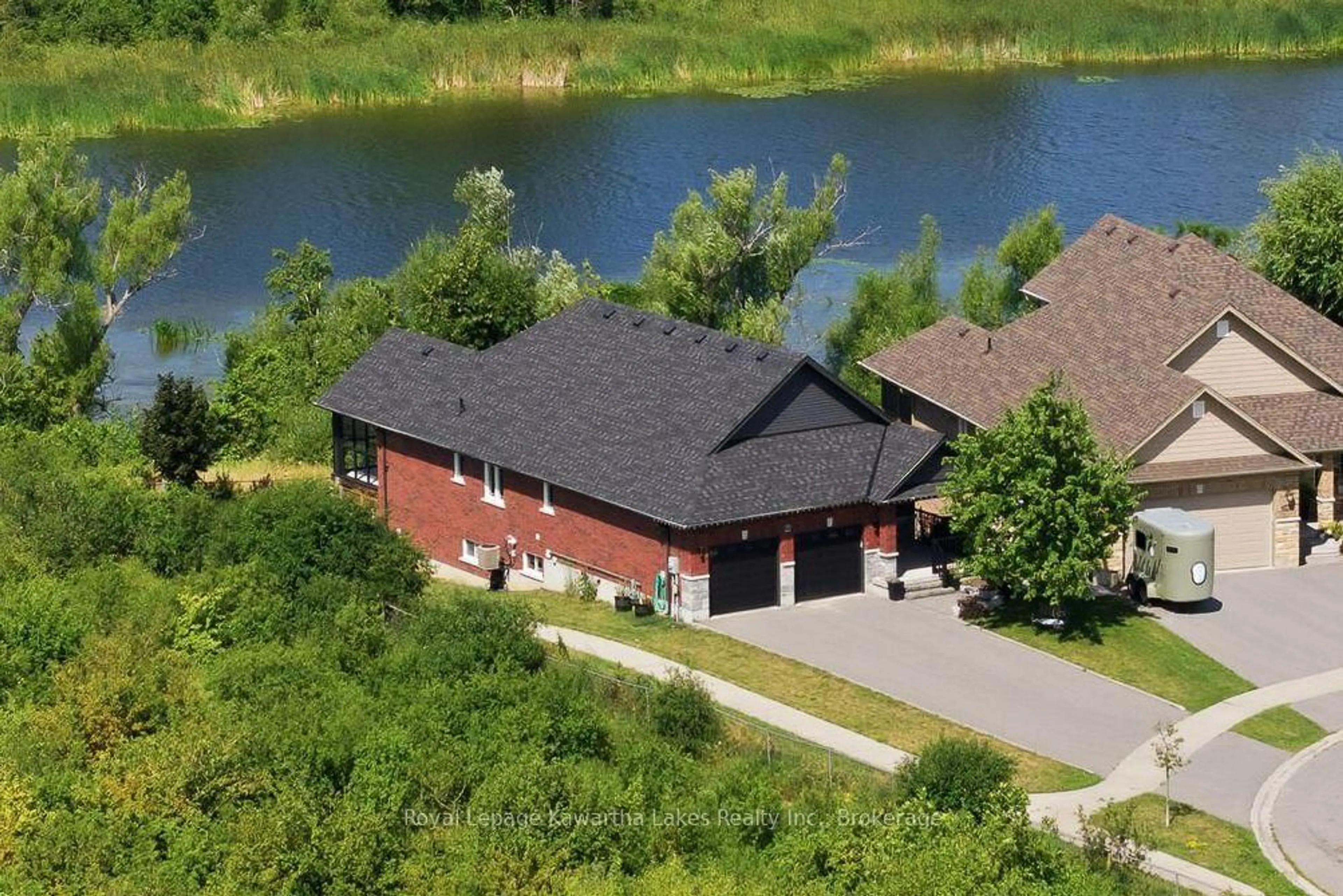 A pic from outside/outdoor area/front of a property/back of a property/a pic from drone, water/lake/river/ocean view for 25 Barron Blvd, Kawartha Lakes Ontario K9V 0C4