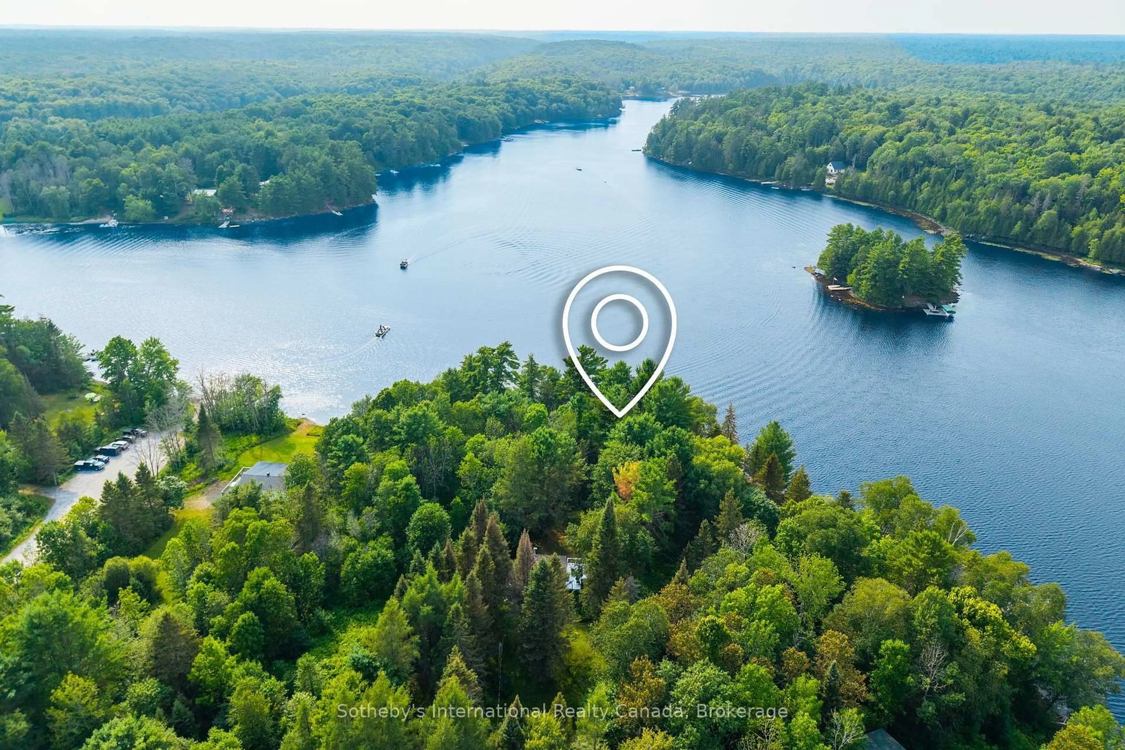 A pic from outside/outdoor area/front of a property/back of a property/a pic from drone, water/lake/river/ocean view for 13 Pine Tree Rd, Magnetawan Ontario P0A 1P0