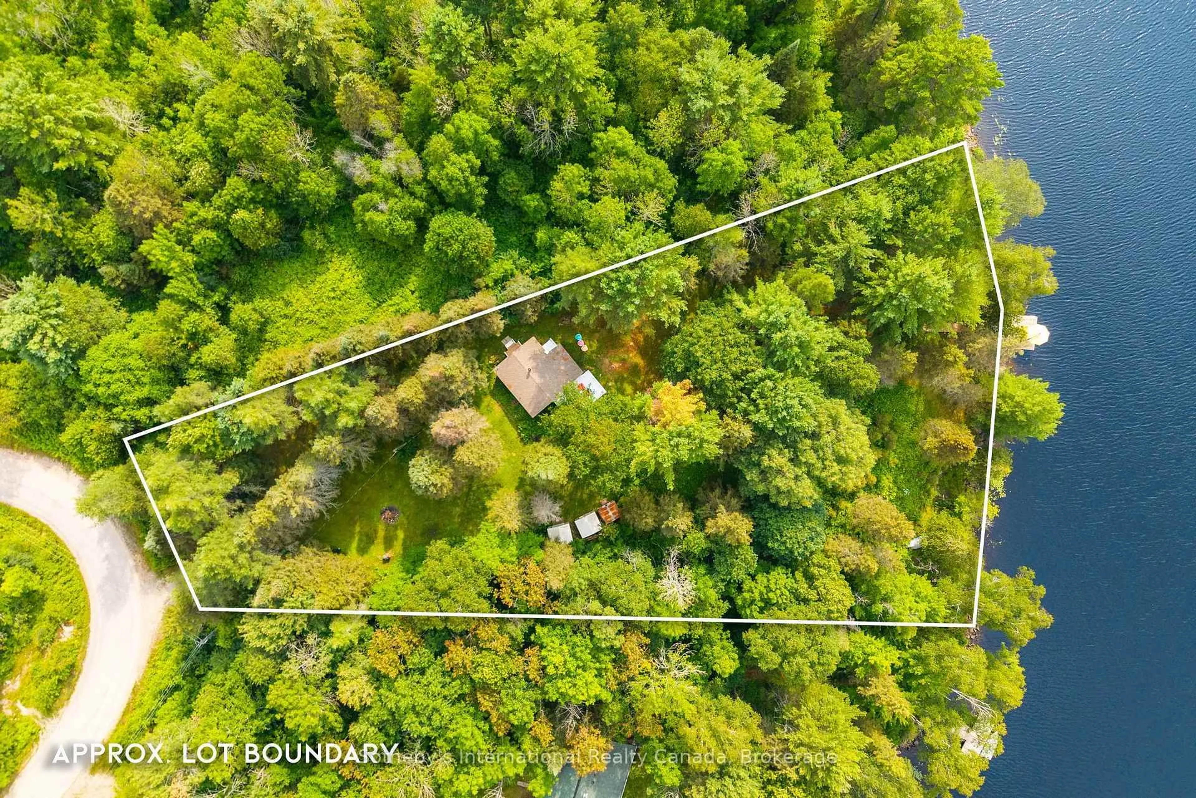 A pic from outside/outdoor area/front of a property/back of a property/a pic from drone, forest/trees view for 13 Pine Tree Rd, Magnetawan Ontario P0A 1P0