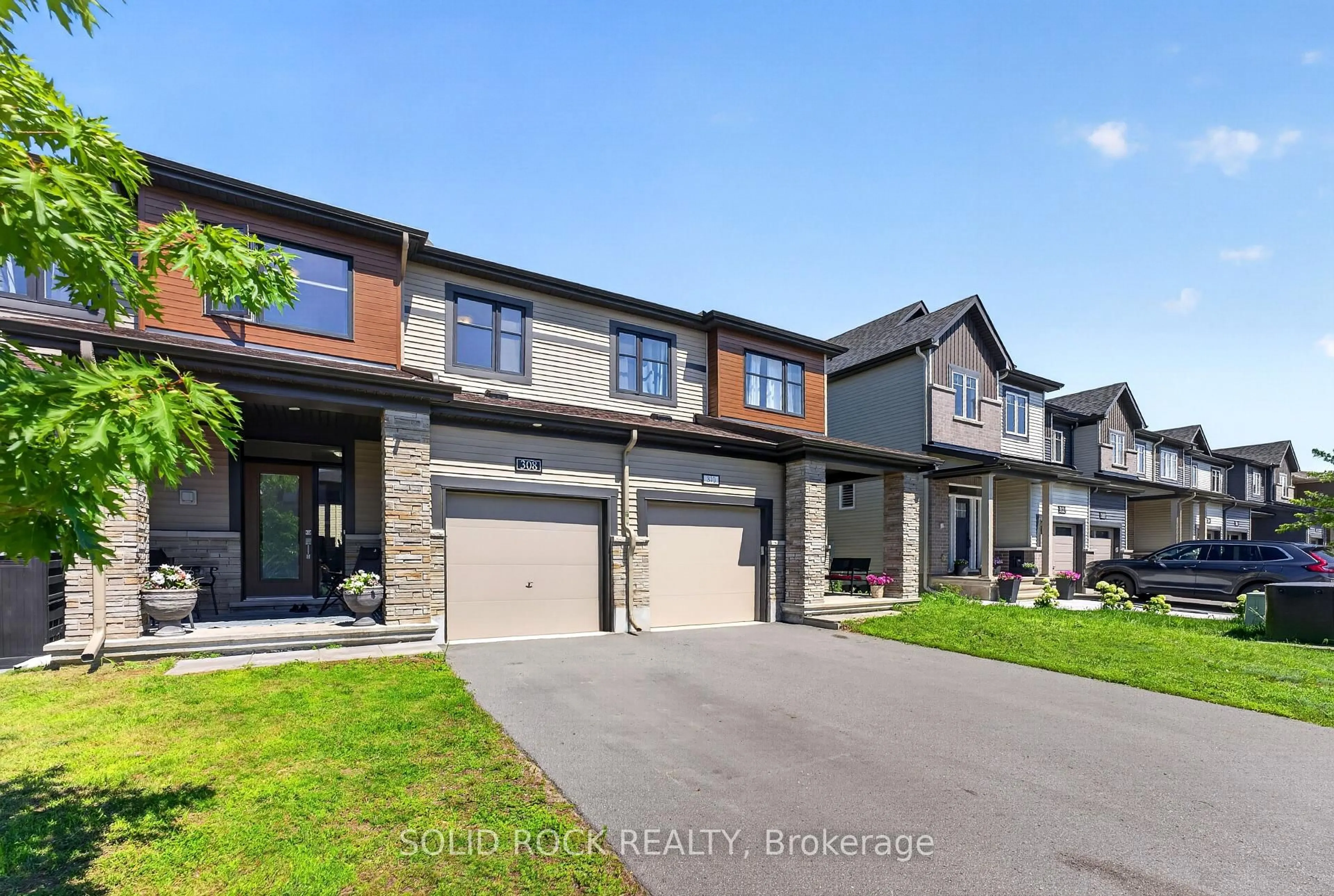 Home with brick exterior material, street for 308 Drumlish Lane, Ottawa Ontario K2J 6Y1