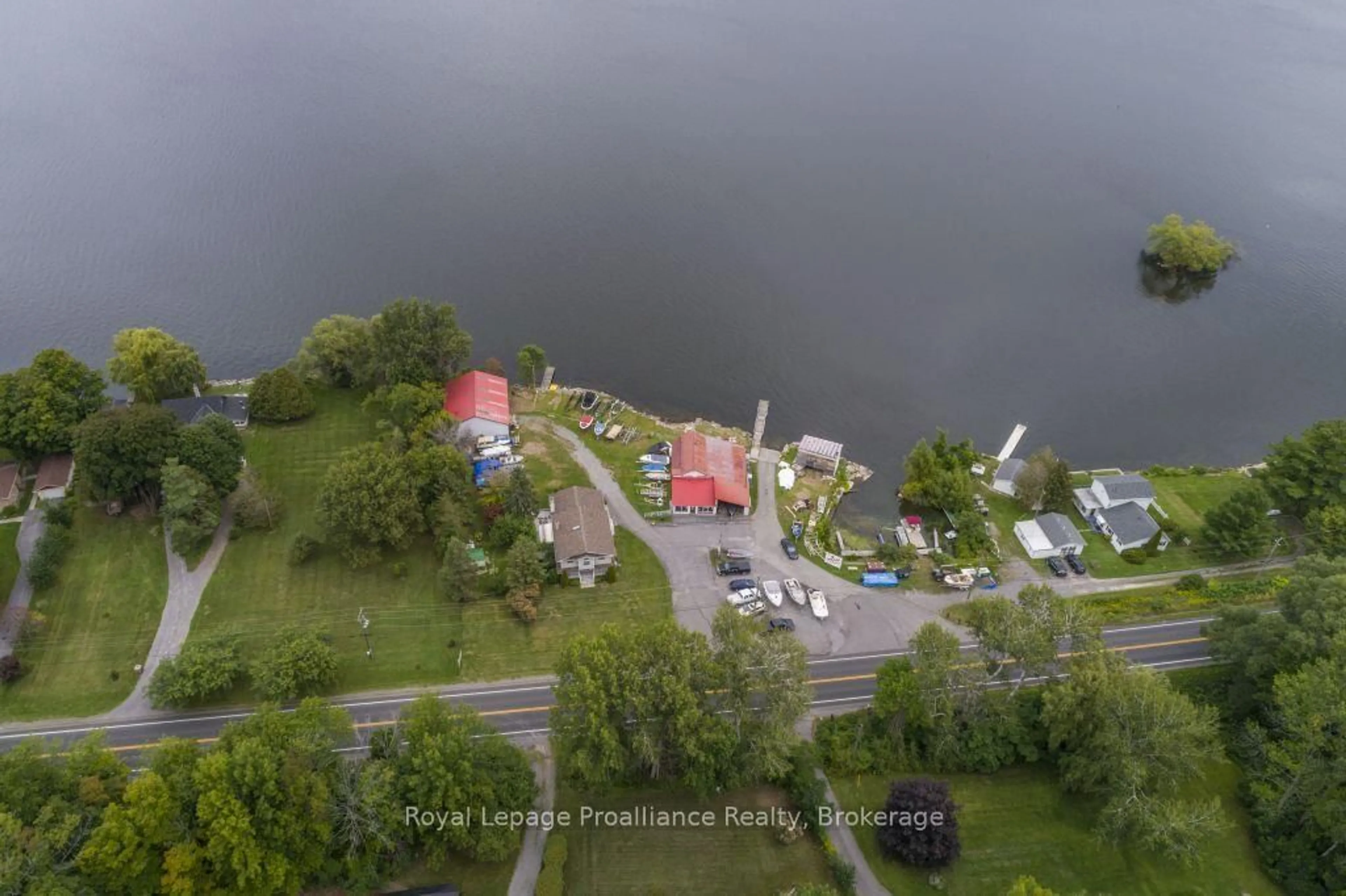 A pic from outside/outdoor area/front of a property/back of a property/a pic from drone, water/lake/river/ocean view for 11438C Loyalist Pkwy, Prince Edward County Ontario K0K 2T0