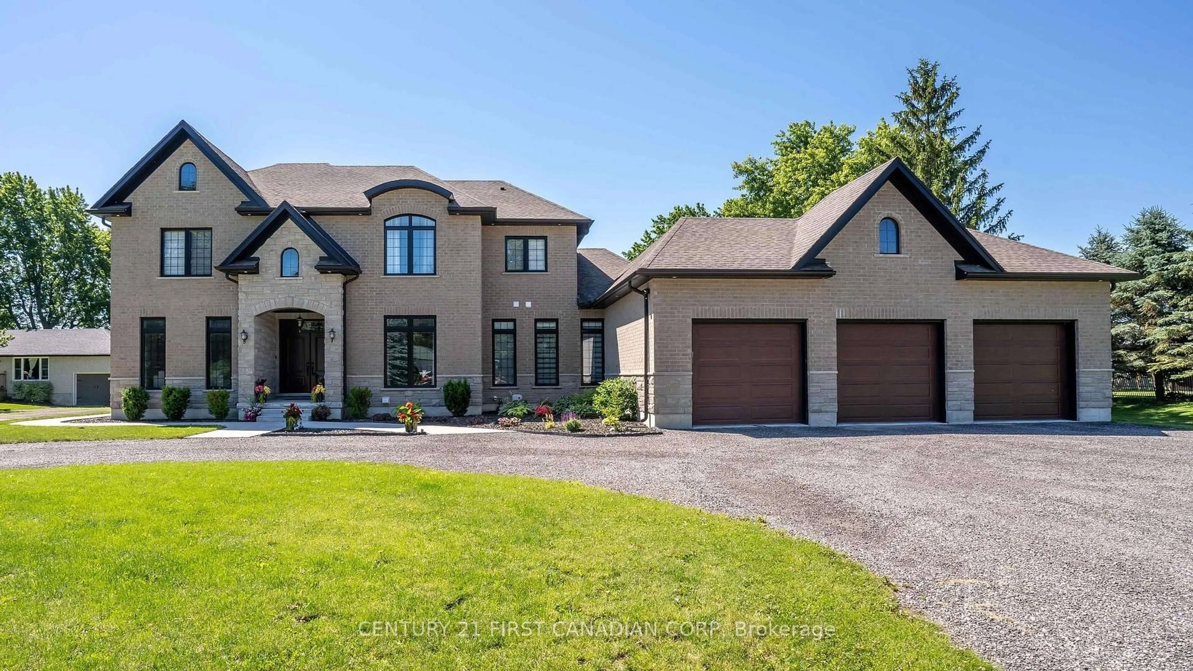 Home with brick exterior material, street for 15257 Twelve Mile Rd, Middlesex Centre Ontario N0M 2A0